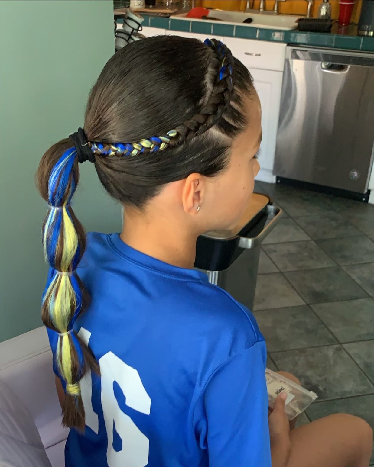 11. Side Braided Ponytail with Blue and Yellow Accents (Softball Hairstyles)