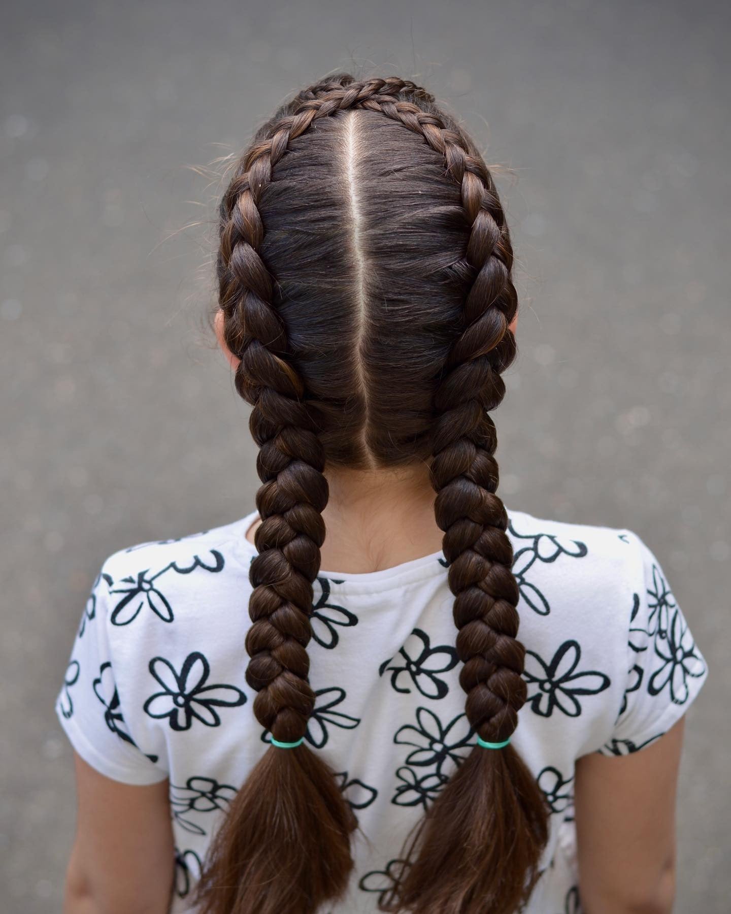 1. Double Dutch Braids with Dark Brunette Shine (Volleyball Hairstyles)