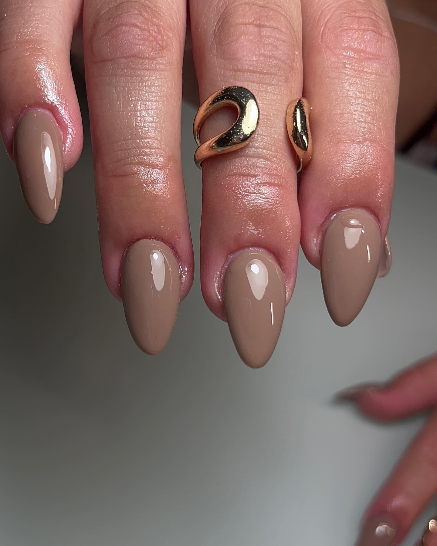 2. Taupe Almond Perfection (Solid Nail Color Ideas)