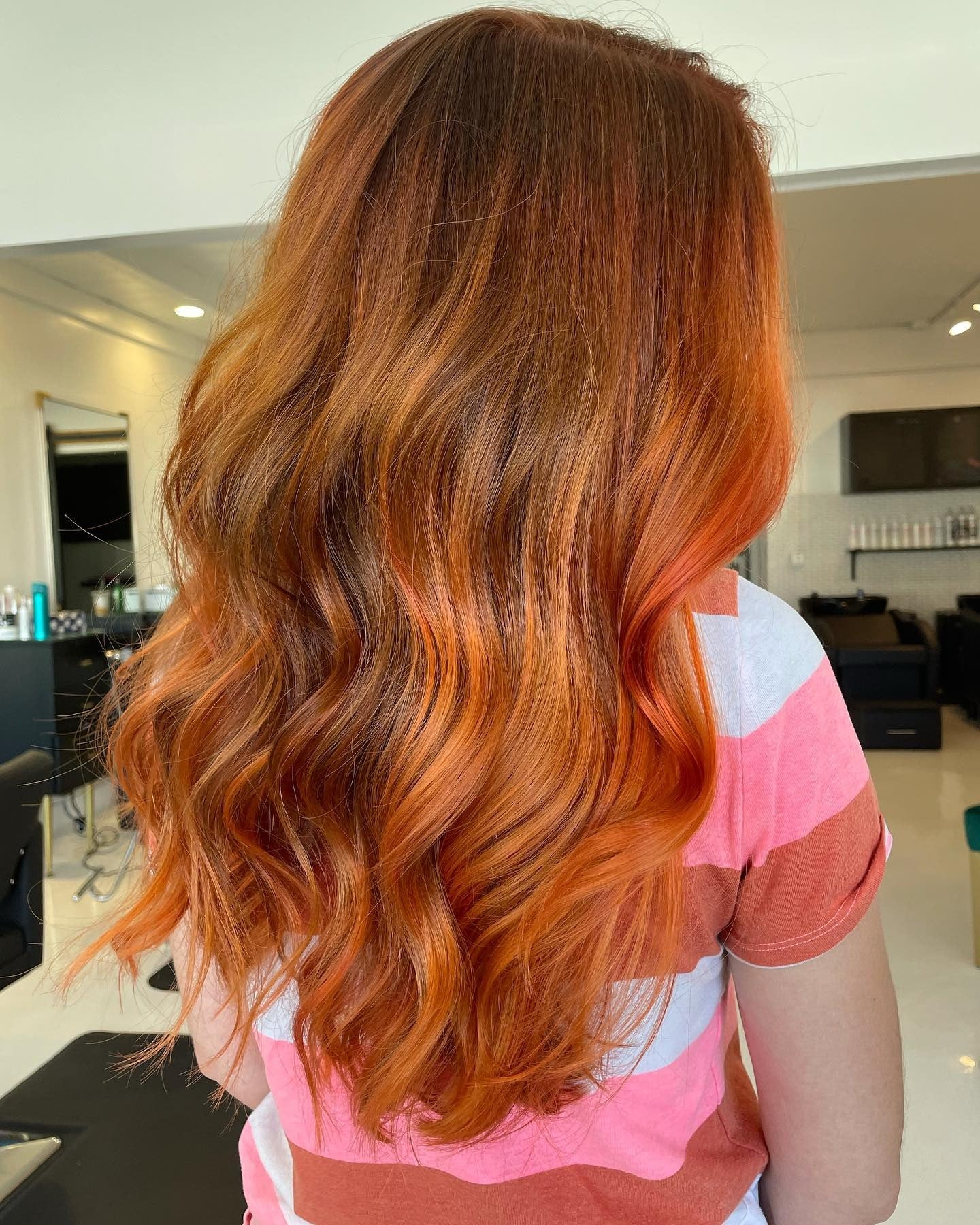 6. Vibrant Pumpkin Spice Waves (Autumn Hair Colors)