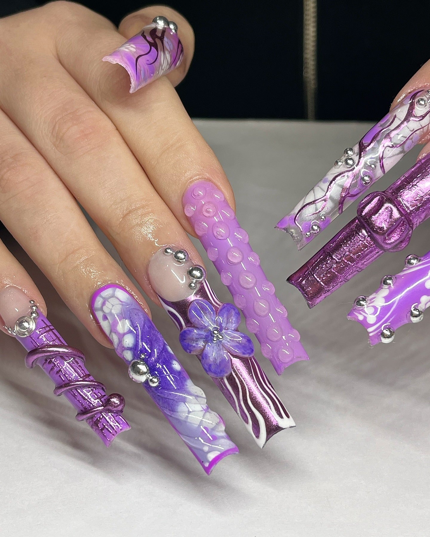 6. Sculpted Fantasy in Purple Chrome (Purple and Lavender Nail Ideas)