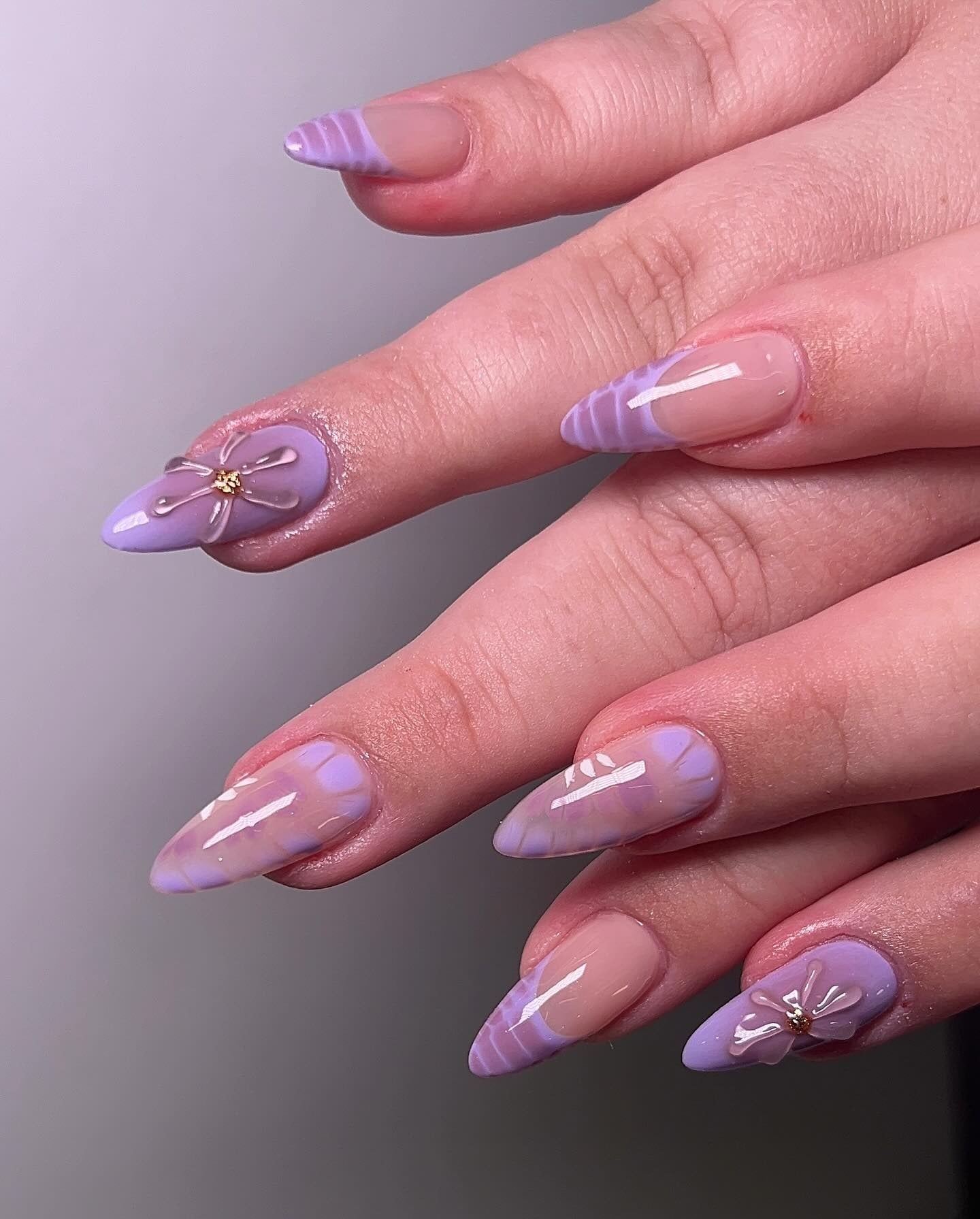 8. Minimal Swirl with Floral Charms (Purple and Lavender Nail Ideas)