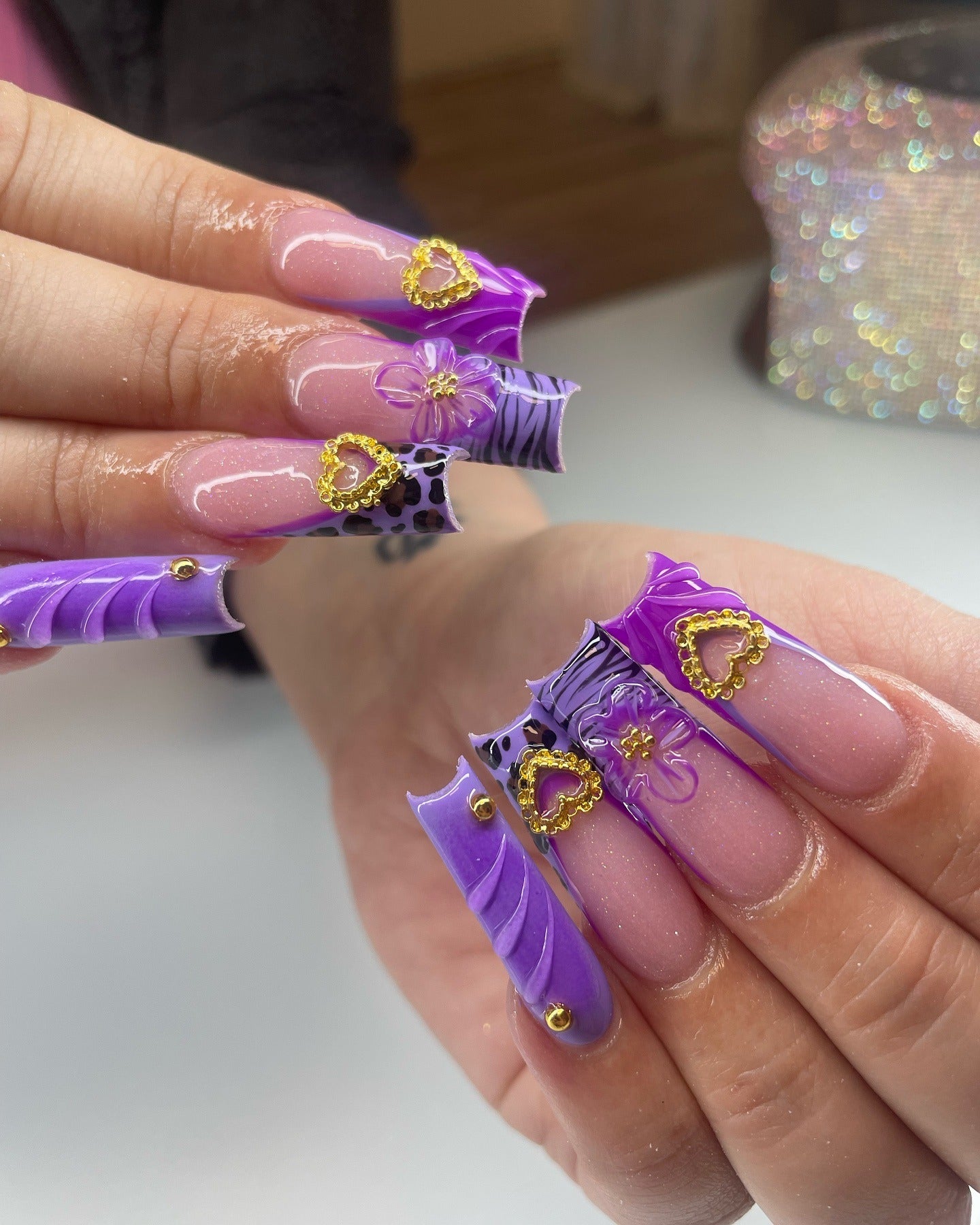 9. Royal Violet with Golden Hearts (Purple and Lavender Nail Ideas)