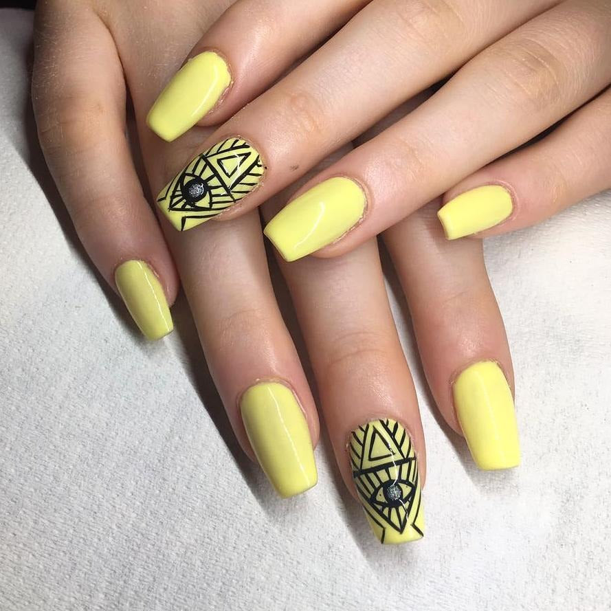 5. Lemon Yellow Nails with Tribal Art Details (Yellow Coffin Nail Ideas)