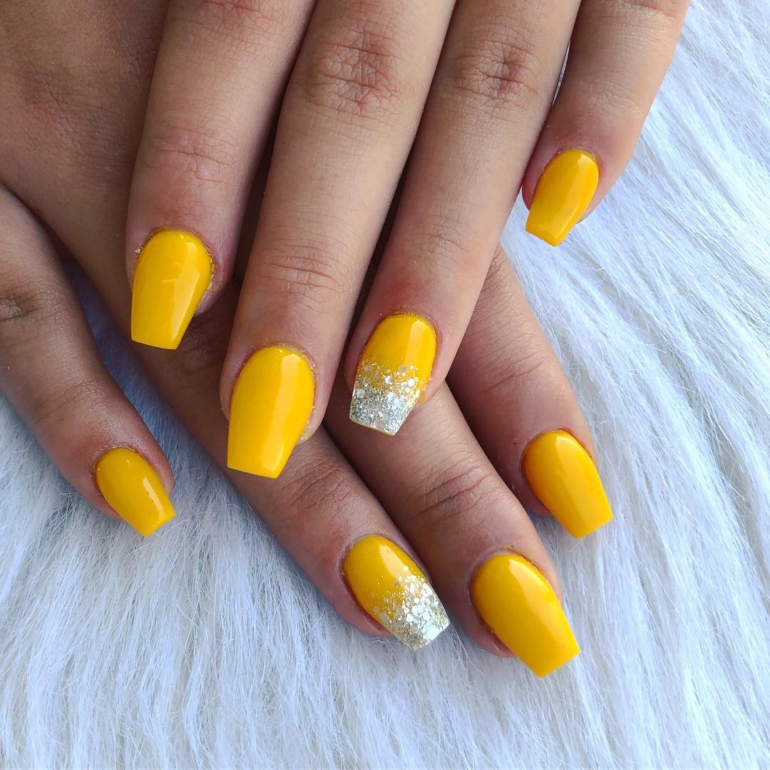 6. Bright Yellow Coffin Nails with Silver Glitter Accents (Yellow Coffin Nail Ideas)