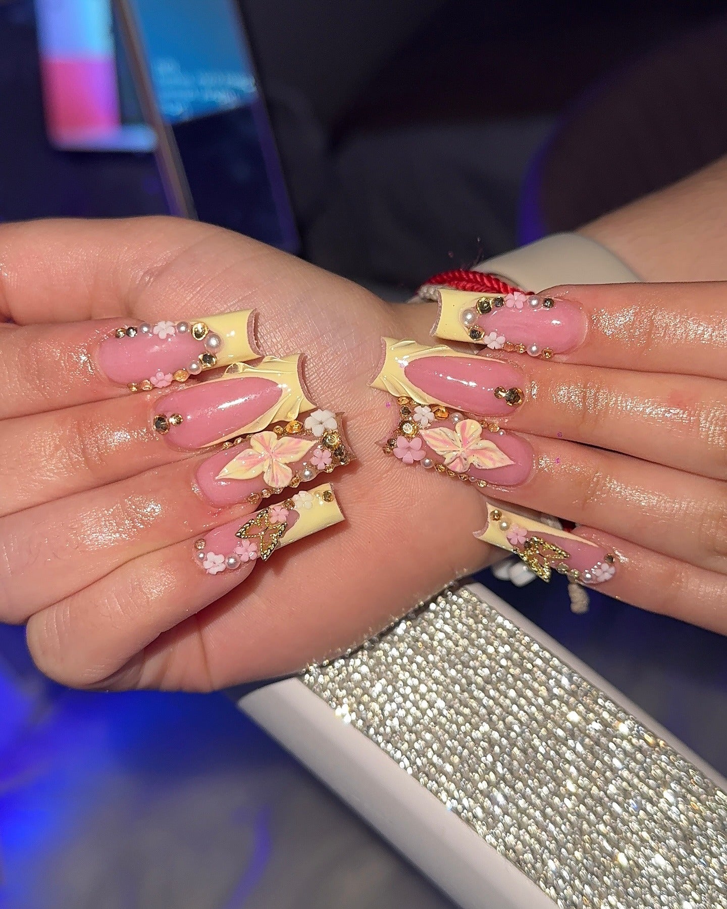 9. Butter Yellow Swirled Coffin Nails with 3D Flowers (Yellow Coffin Nail Ideas)