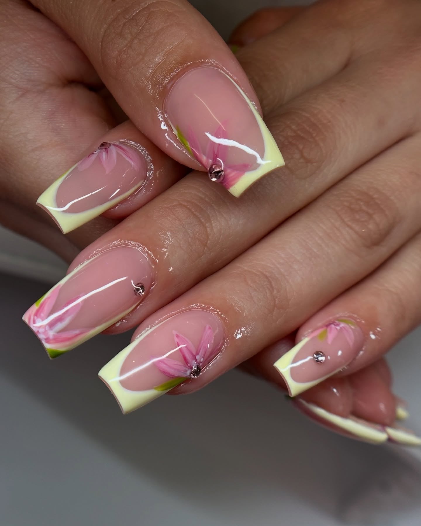12. Soft Yellow French Coffin Nails with Floral Art (Yellow Coffin Nail Ideas)