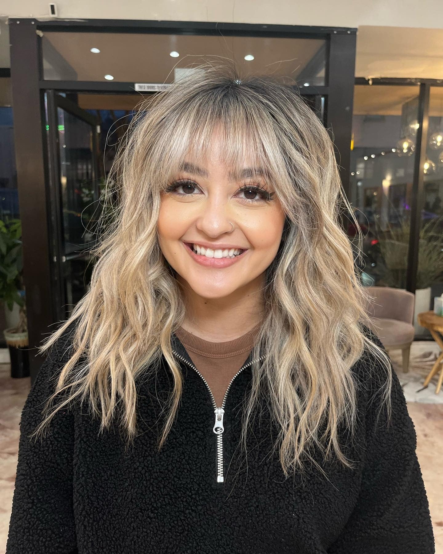 7. Platinum Blonde Waves with Root Shadow and Fringe (Bangs Hairstyles)