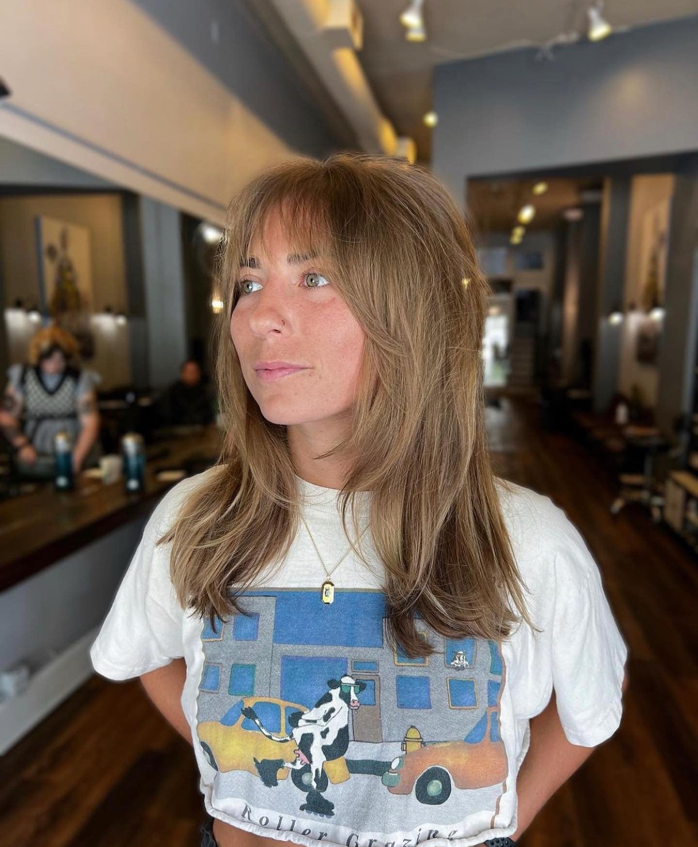 13. Ash Brown Layers with Shaggy Curtain Bangs (Bangs Hairstyles)