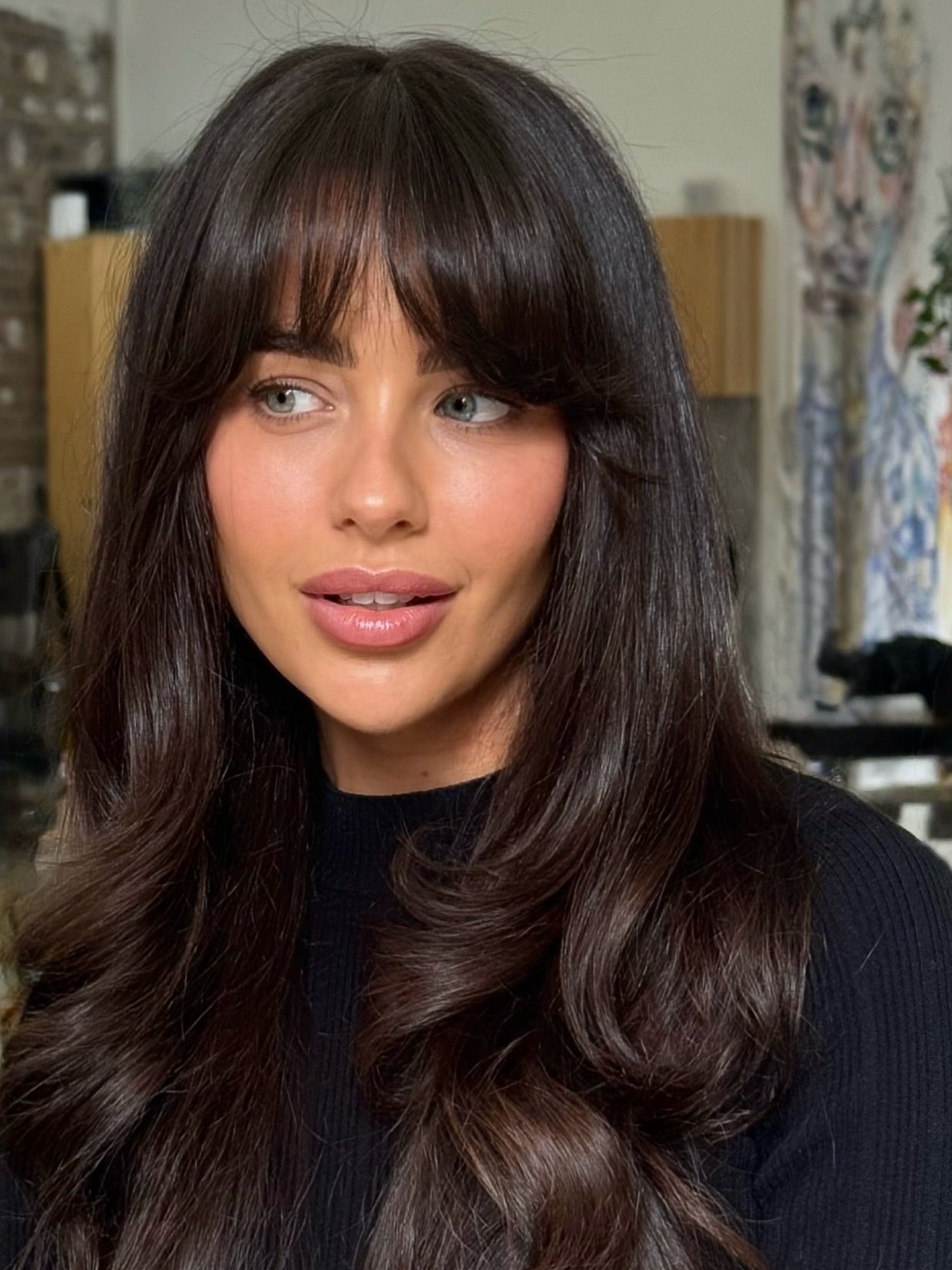 14. Polished Layers with Long Rounded Fringe (Bangs Hairstyles)