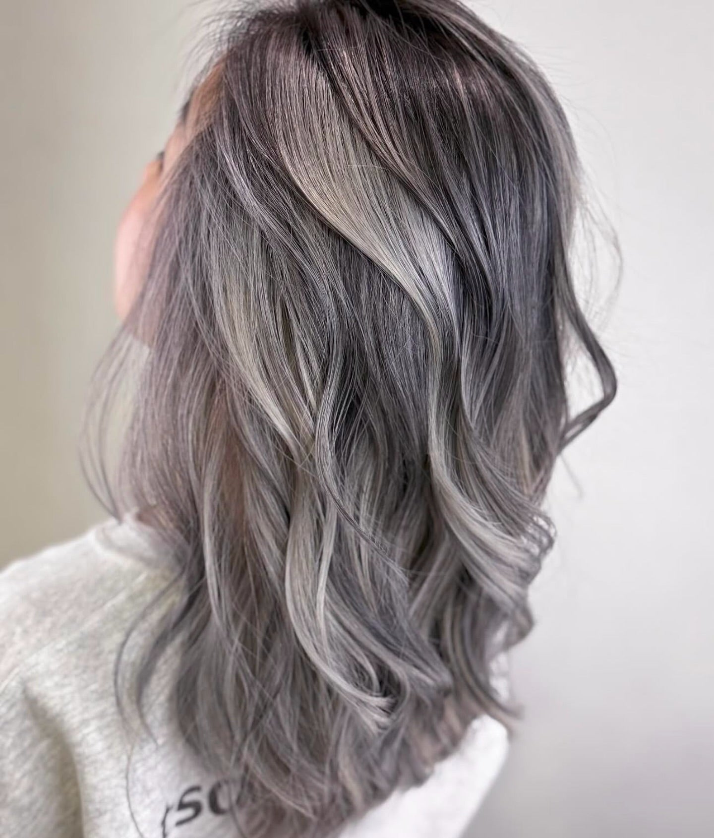 14. Wavy Graphite and Pearl Gray Blend (Gray Hairstyles for Women)