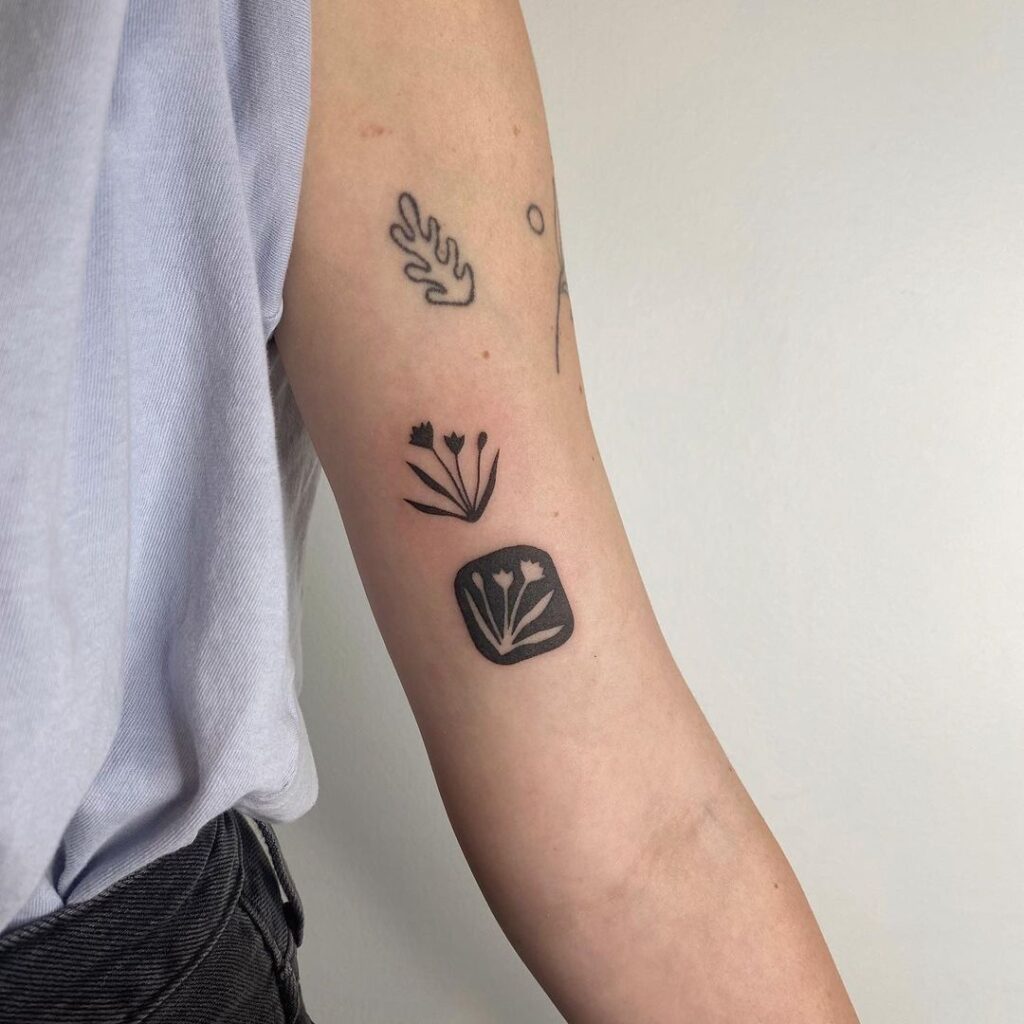 Negative Space Small Flowers Tattoo