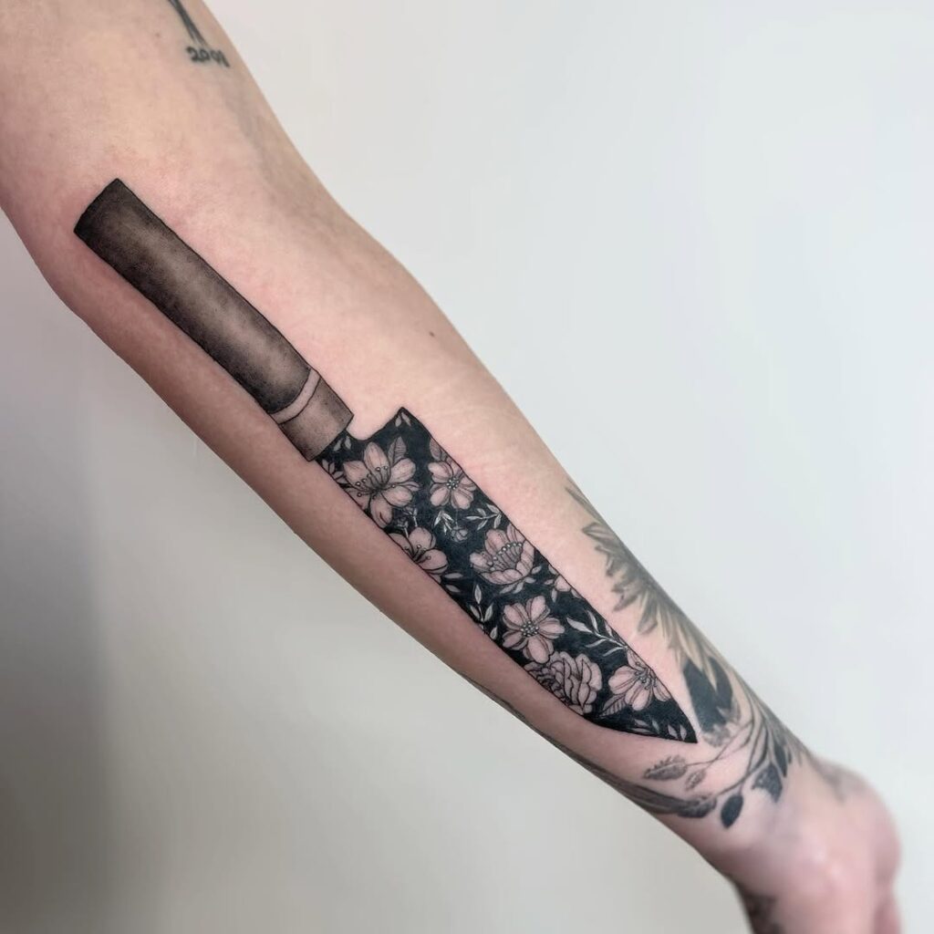 Negative Space Knife Tattoo