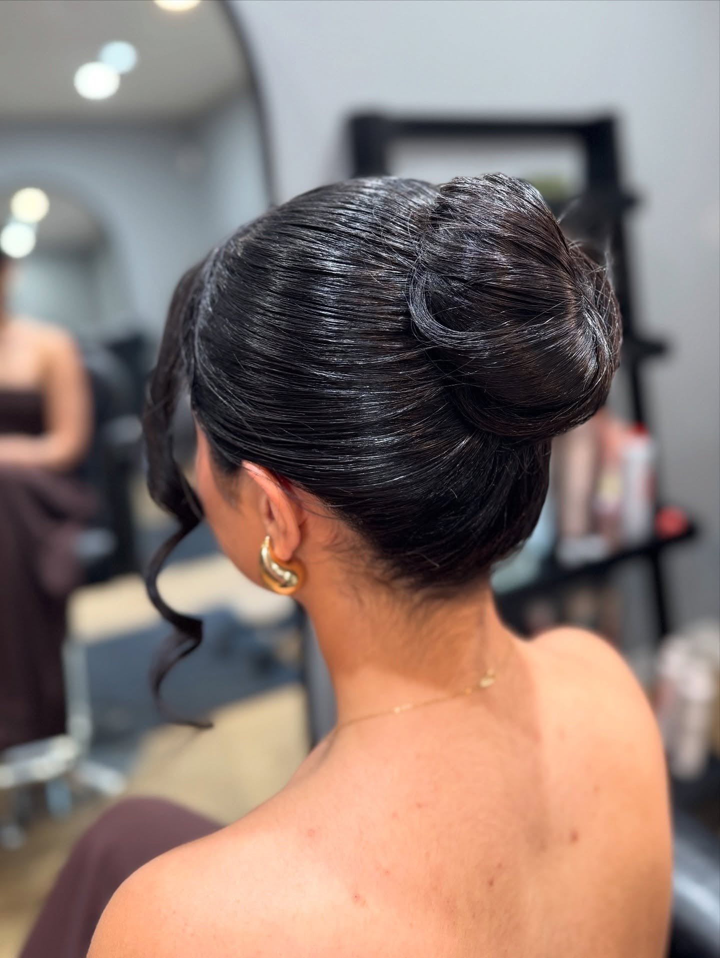 6. Sleek Ballerina Bun with Defined Twirl (Simple Hairstyles)