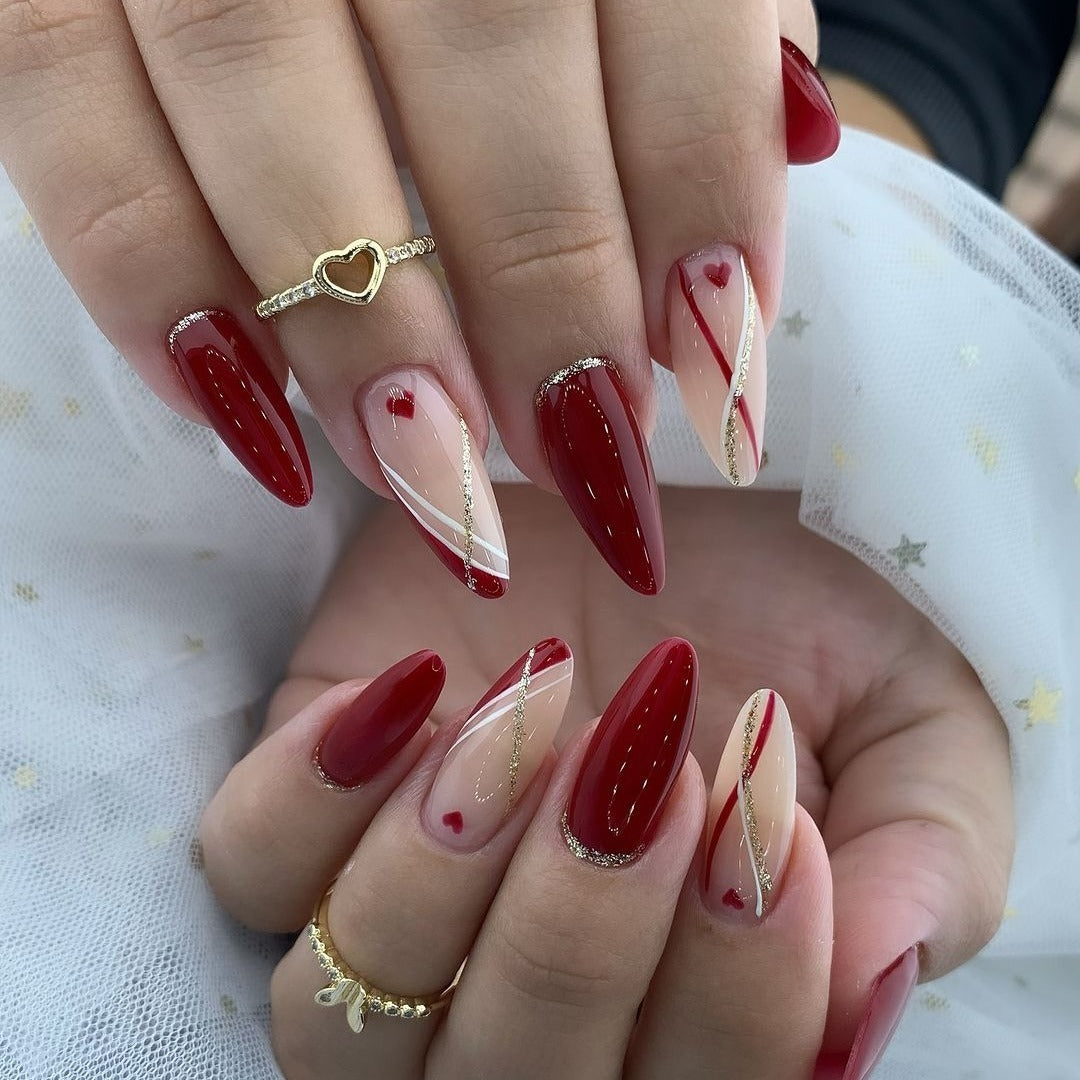 6. Red and Nude Swirl Accent Nails (Red Prom Nail Ideas)
