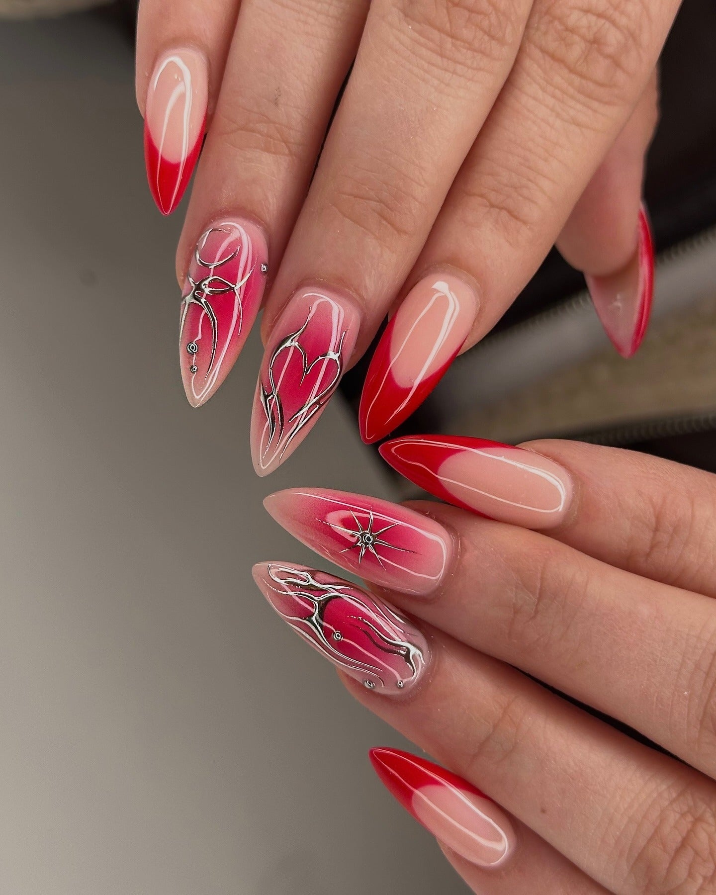 10. Sculpted Chrome Heart Nails (Red Prom Nail Ideas)