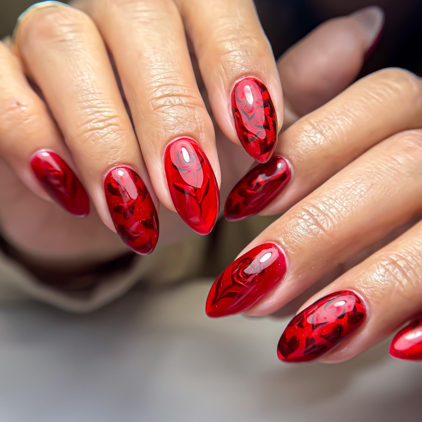 11. Red Marble Floral Almond Nails (Red Prom Nail Ideas)