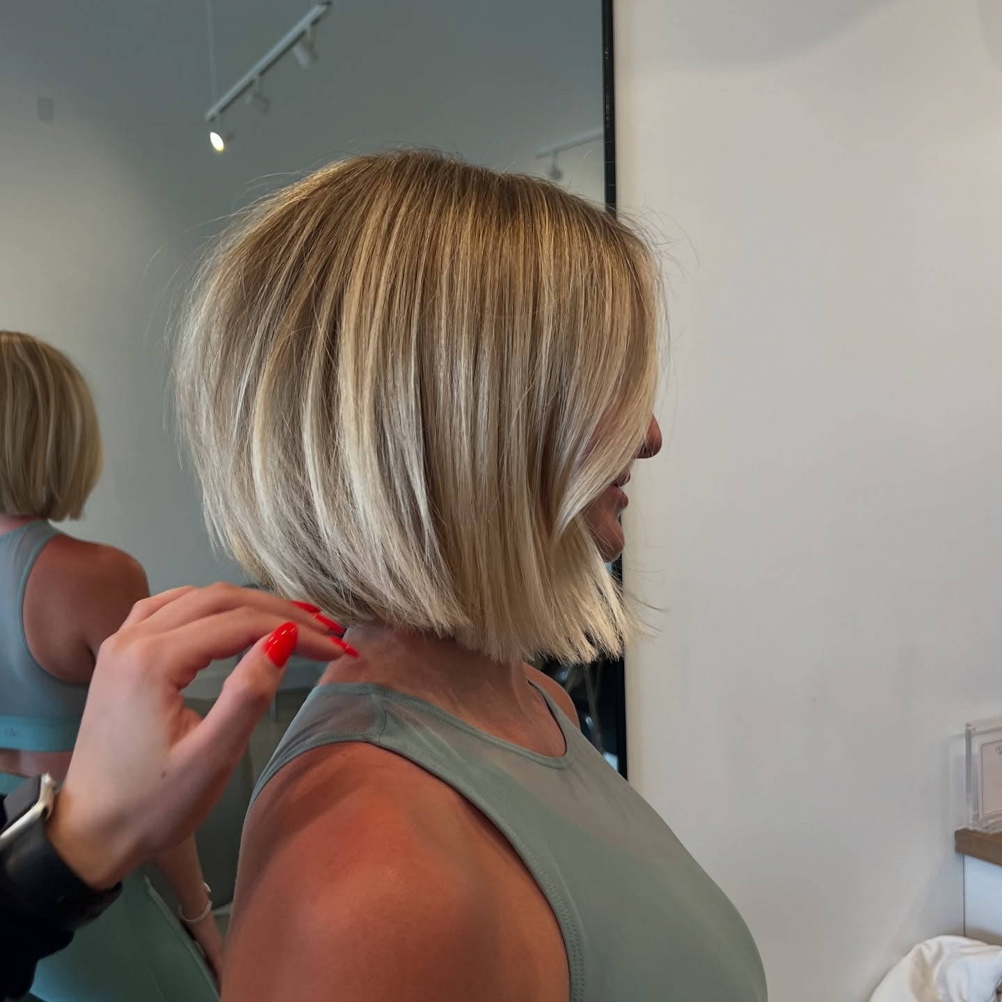 7. Polished Angled Bob with Light Blonde (Layered Bob Hairstyles)
