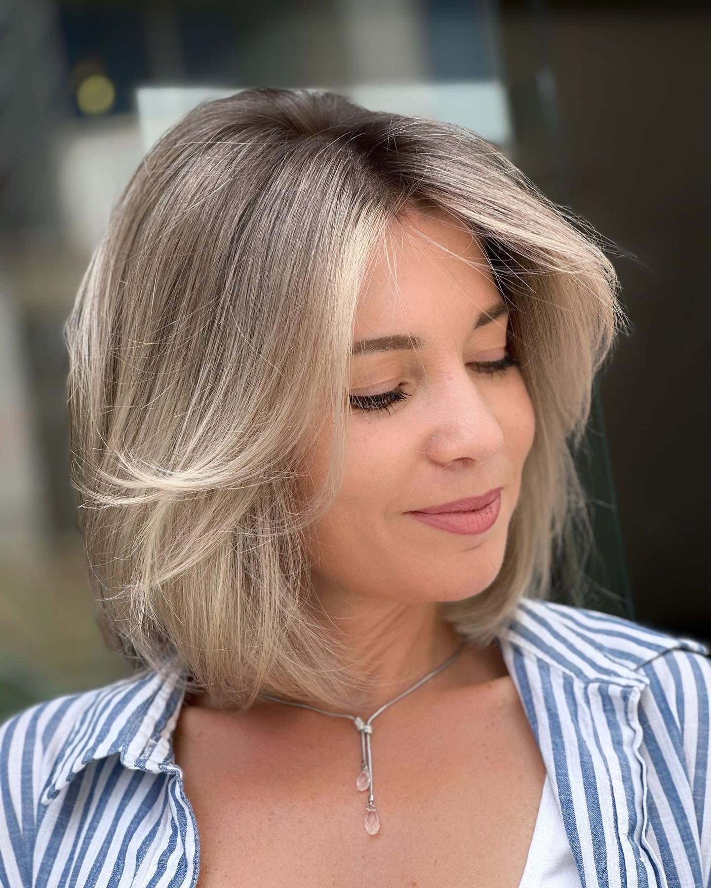 12. Feathered Bob with Ash Blonde Balayage (Layered Bob Hairstyles)