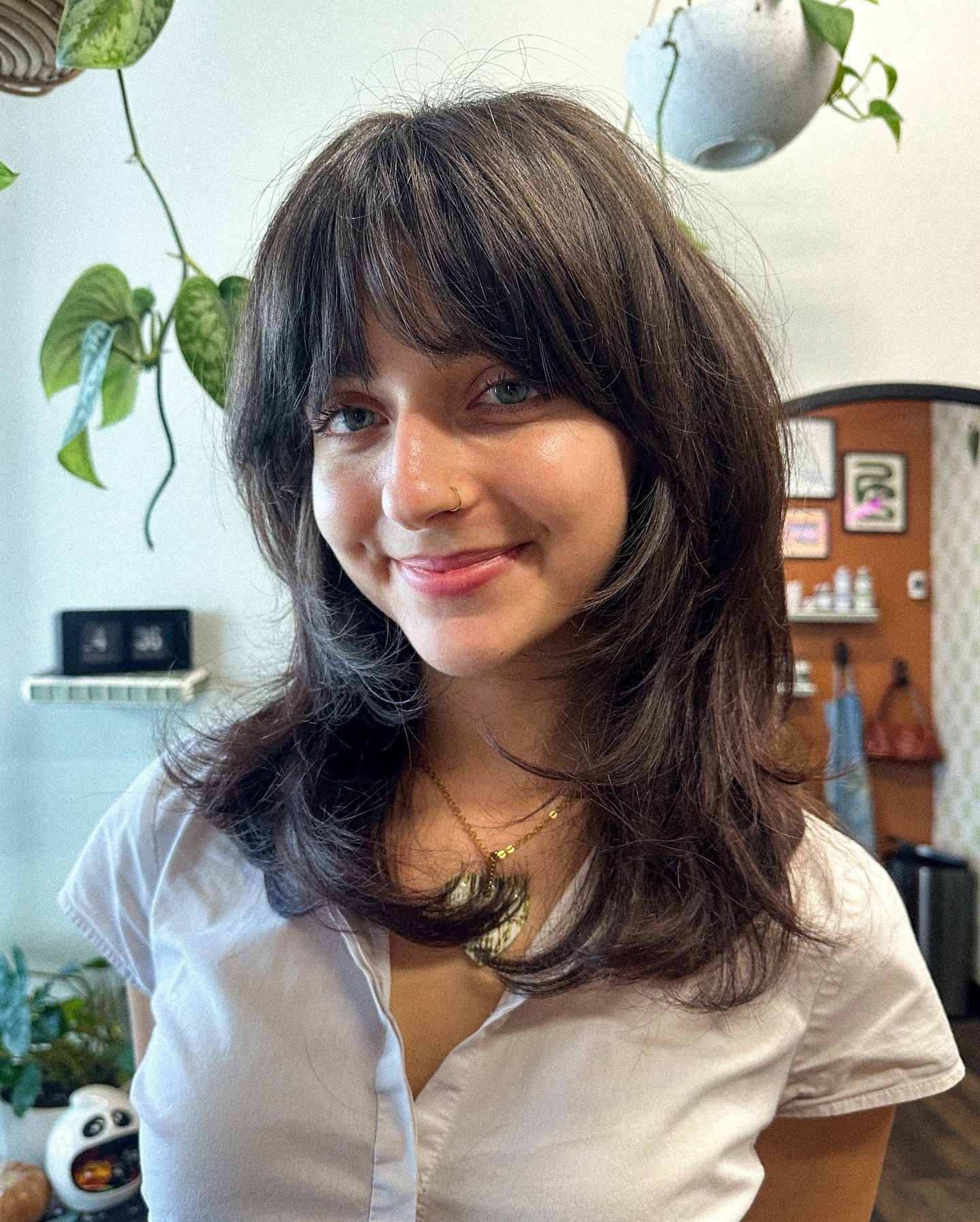 7. Textured Layers with Natural Dark Brown Shade (Medium Haircuts With Bangs)