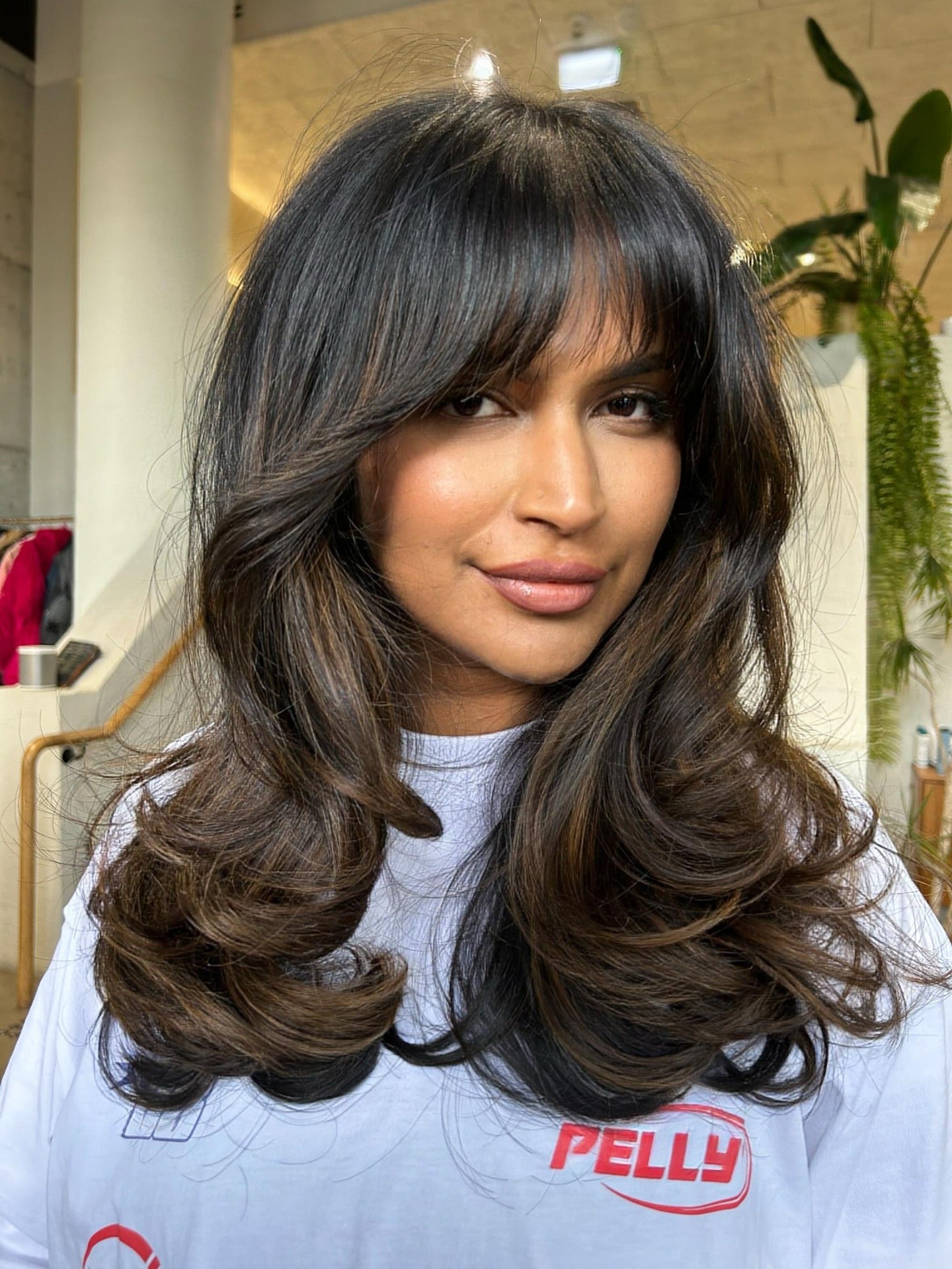 11. Layered Volume with Dark Chocolate Balayage (Medium Haircuts With Bangs)