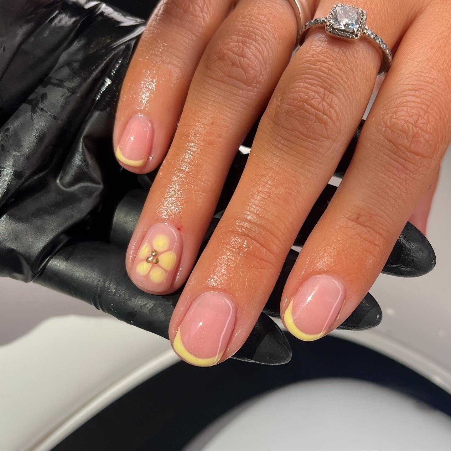 10. Single Bloom Yellow French Nails (Short Spring Break Nail Ideas)