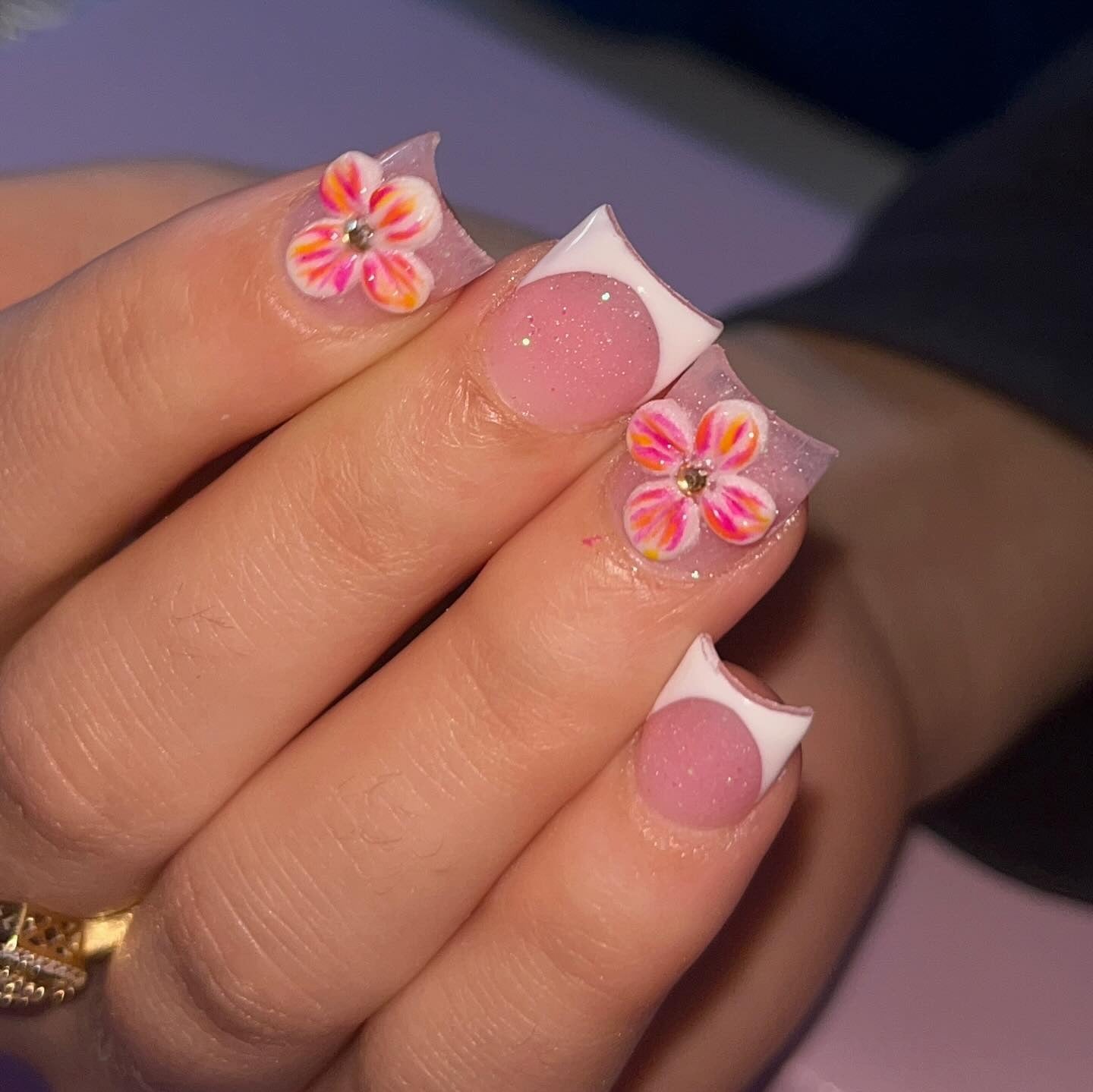 12. White French Tips with Tropical Bloom Accents (Short Spring Break Nail Ideas)