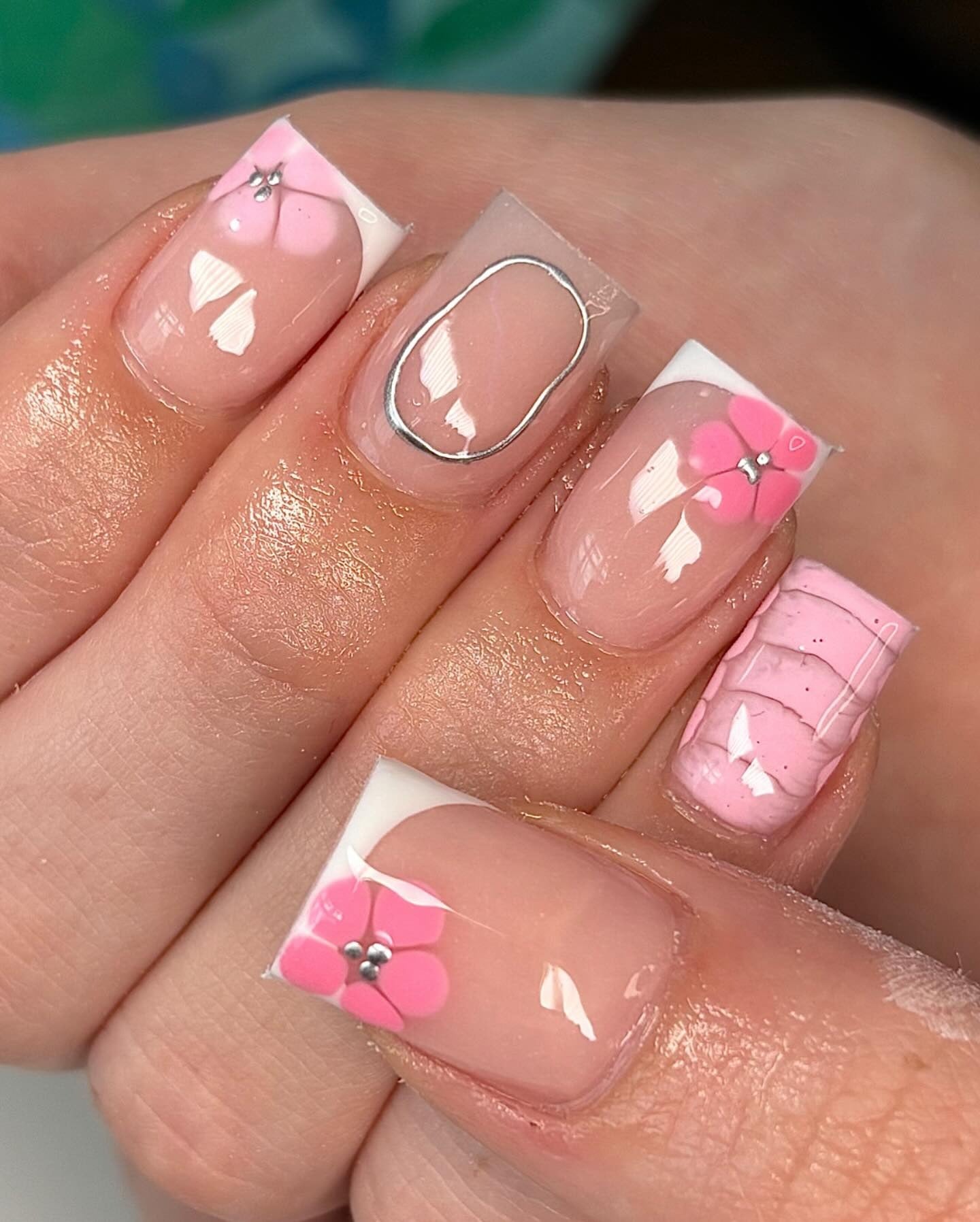 13. Pink Floral French Tips with Textured Accent (Short Spring Break Nail Ideas)