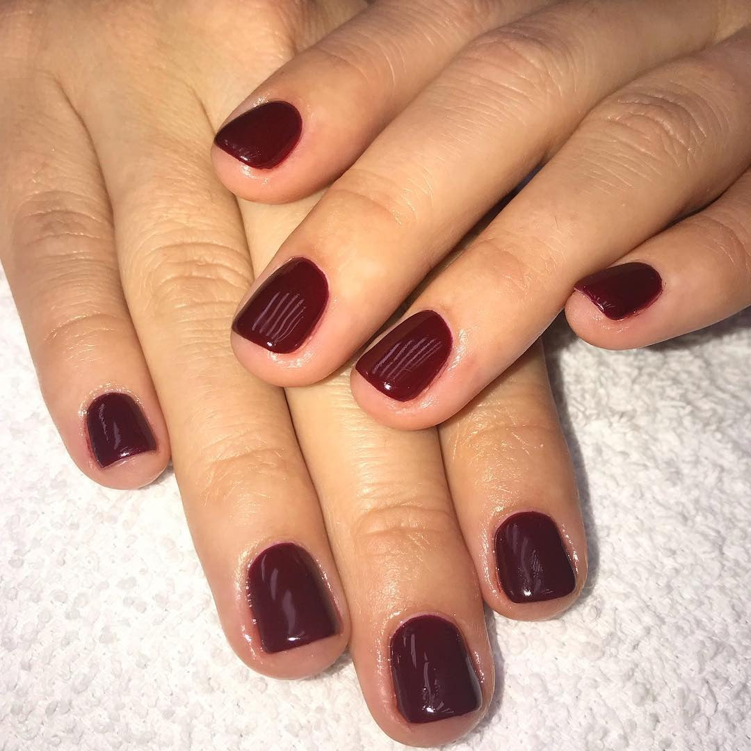 4. Classic Cranberry Gloss (Short Thanksgiving Nail Ideas)