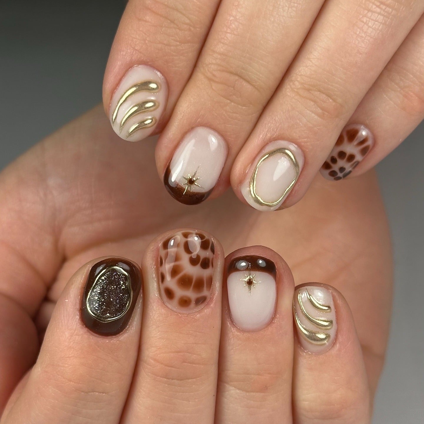 6. Textured Neutrals with Gilded Highlights (Short Thanksgiving Nail Ideas)
