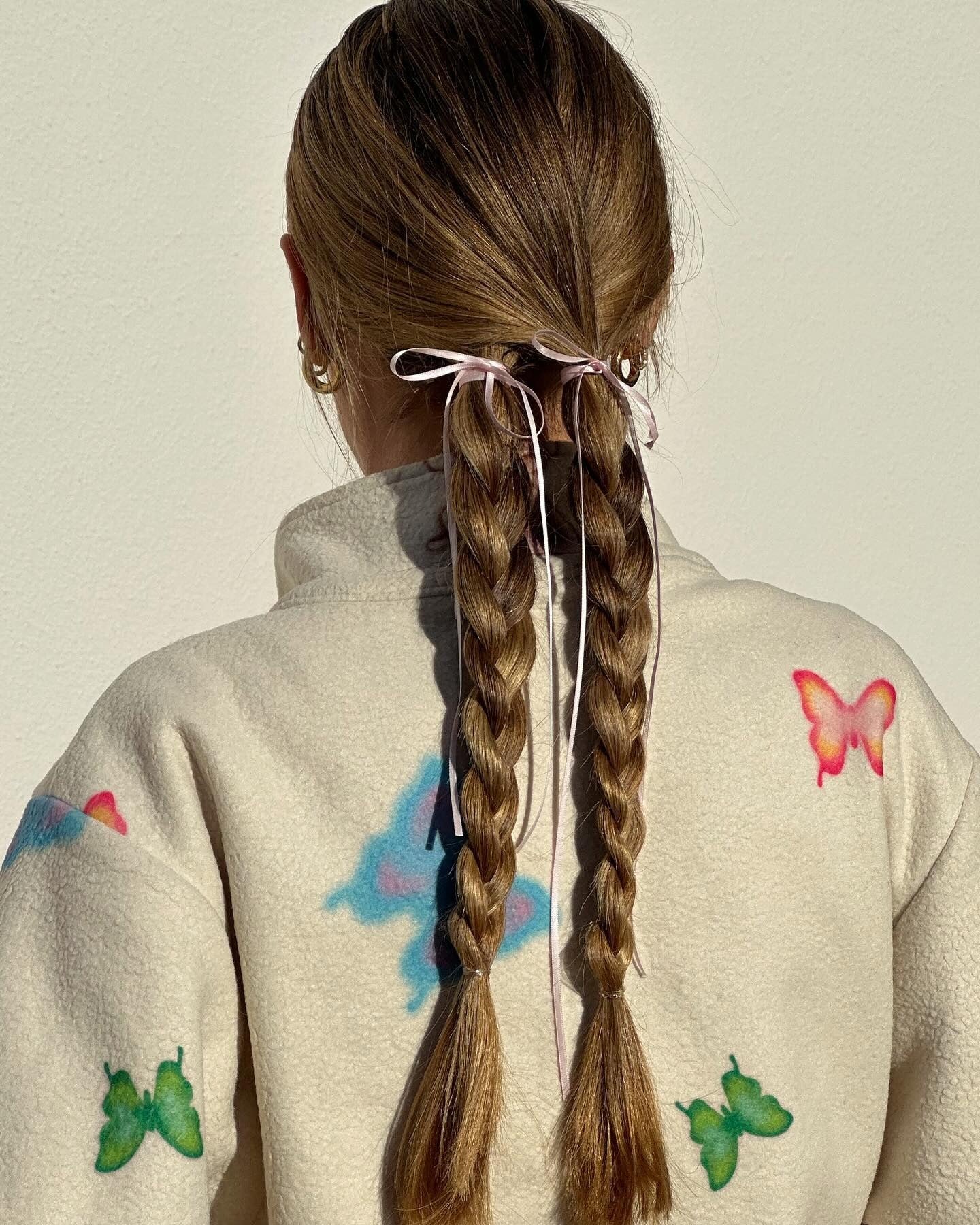 7. Twin Braids with Ribbon Ties (Simple Hairstyles)