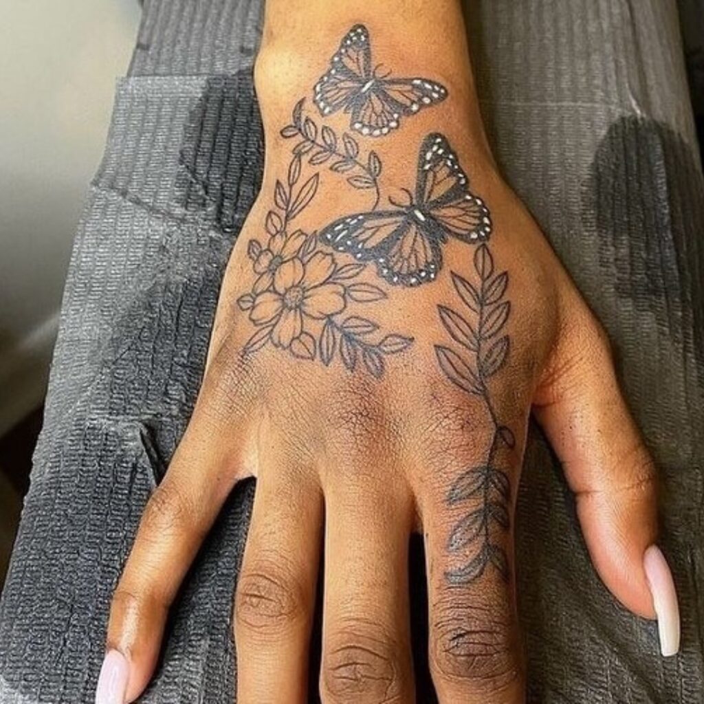 Butterflies And Flowers Hand Tattoo