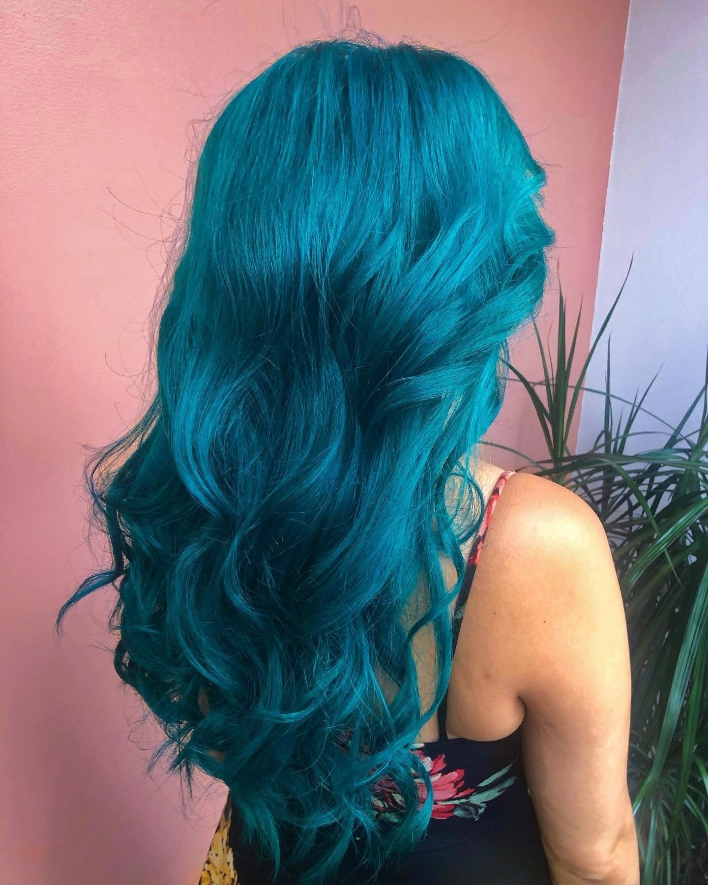 15. Voluminous Teal Curls (Teal Hair Color)