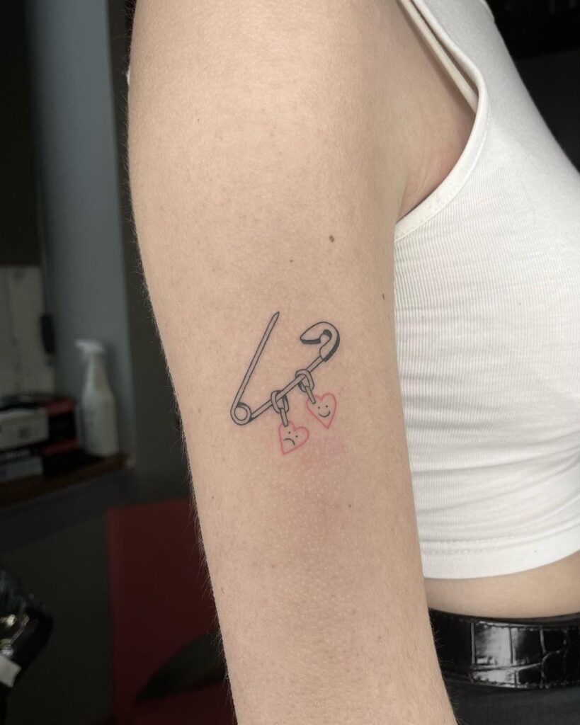 Safety Pin And Happy-Sad Hearts Tattoo