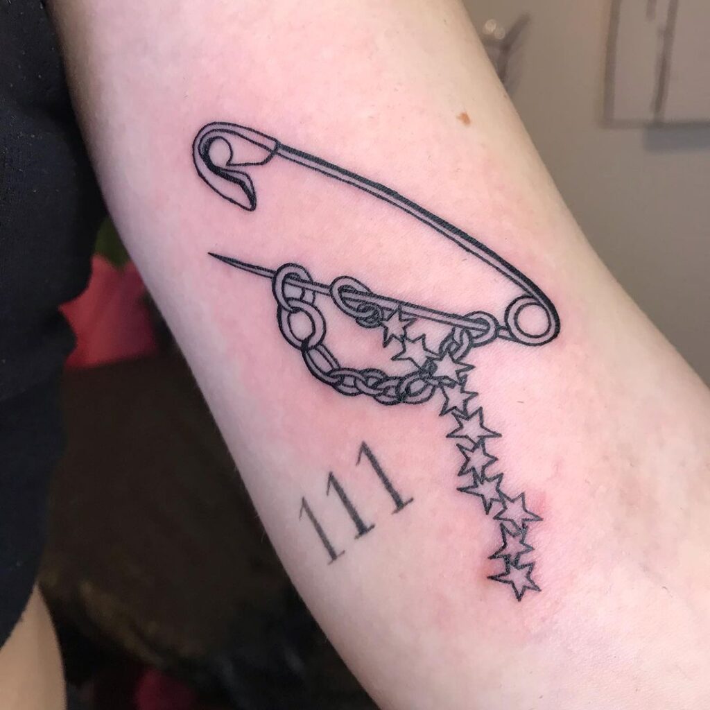 Safety Pin And Stars Tattoo