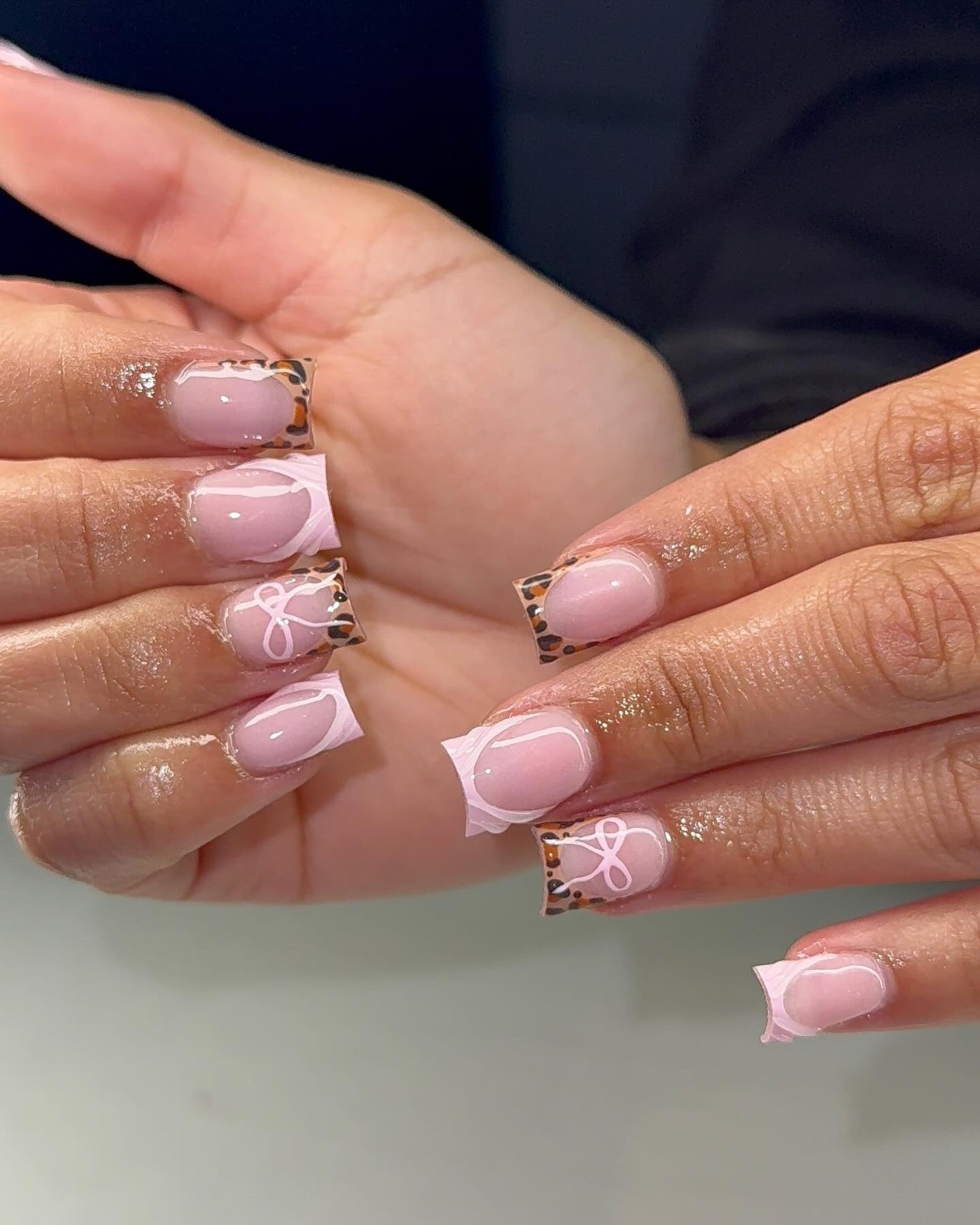 5. Leopard Tips with Pink Bows (Classy Short Nail Ideas)