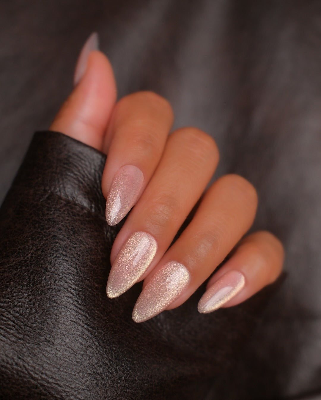5. Champagne Shimmer Almond Nails (Clear Nail Ideas)