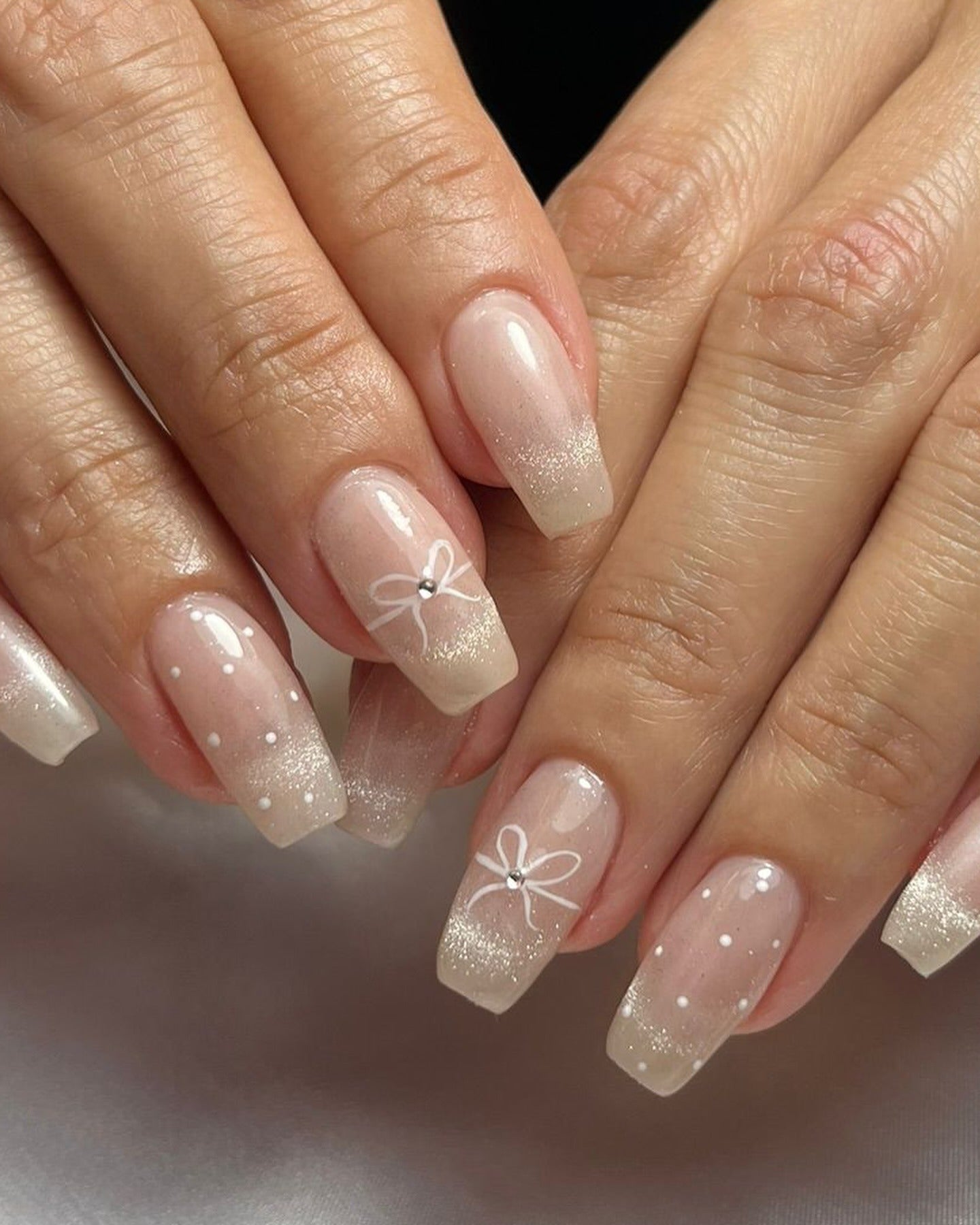 10. Soft Glitter Bow Nails (Clear Nail Ideas)