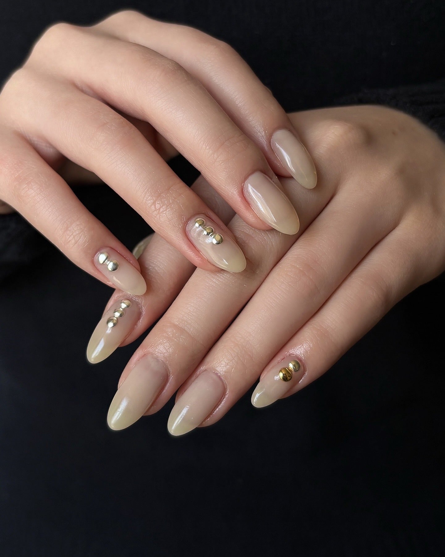 12. Nude Almond Nails with Metallic Studs (Clear Nail Ideas)