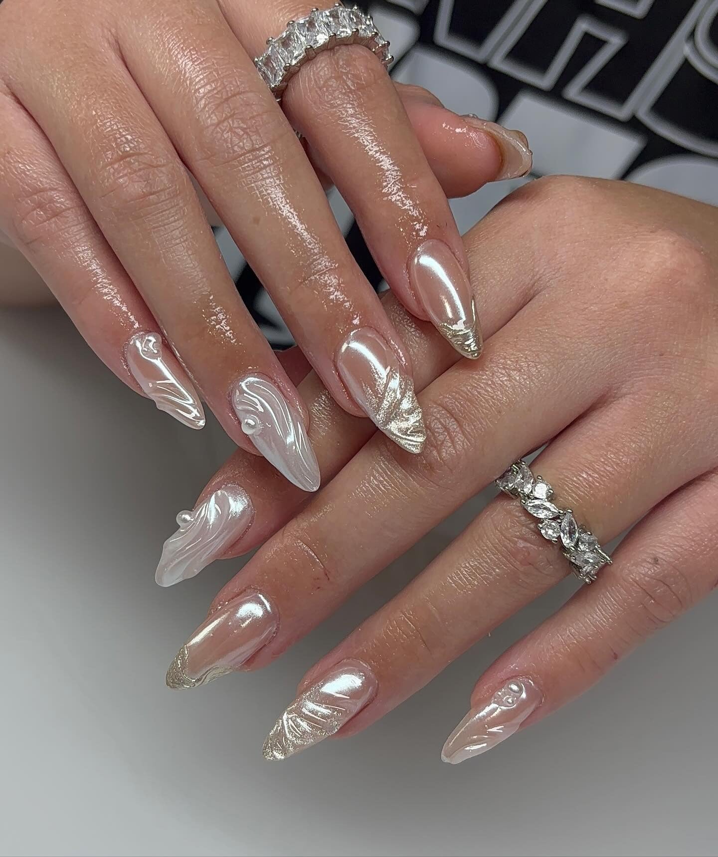 15. Pearlized 3D Almond Nails (Clear Nail Ideas)