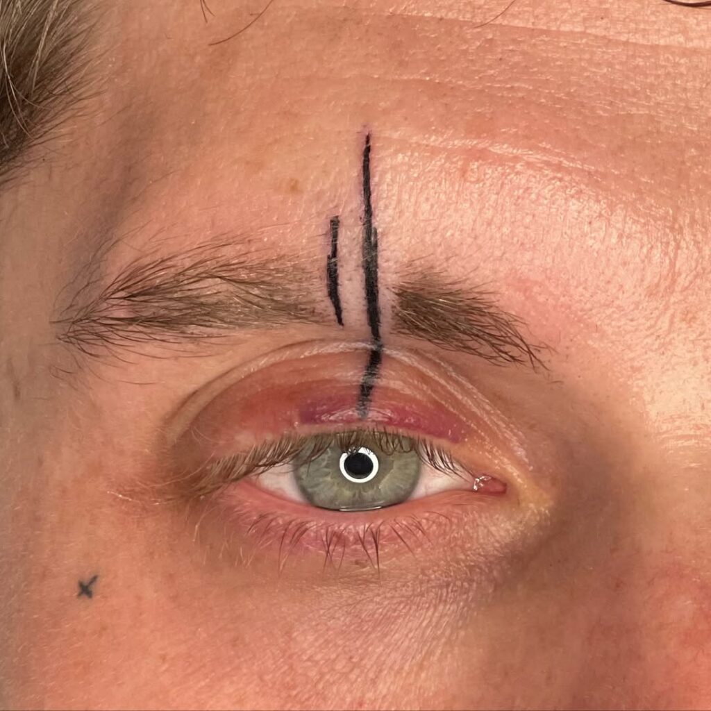 Thin Lines Face Tattoo