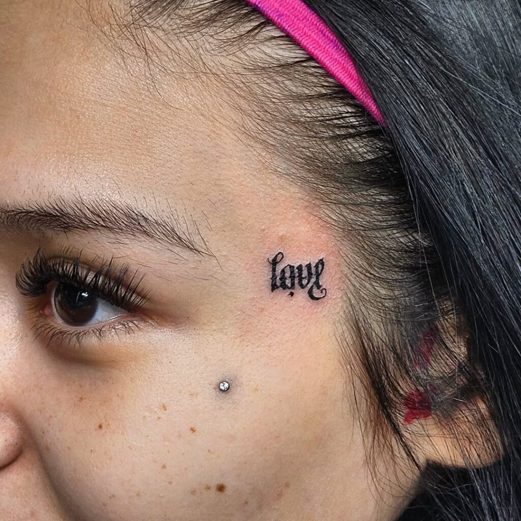 Single Word Face Tattoo