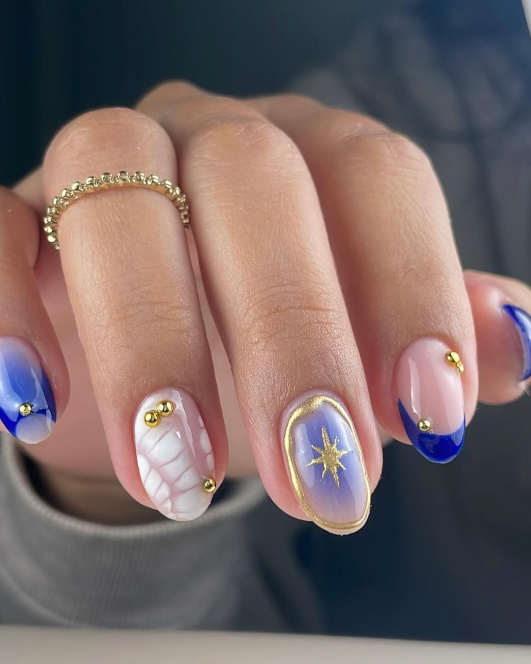 6. Celestial Blue Nails with Gold Details (Cool Nail Ideas)