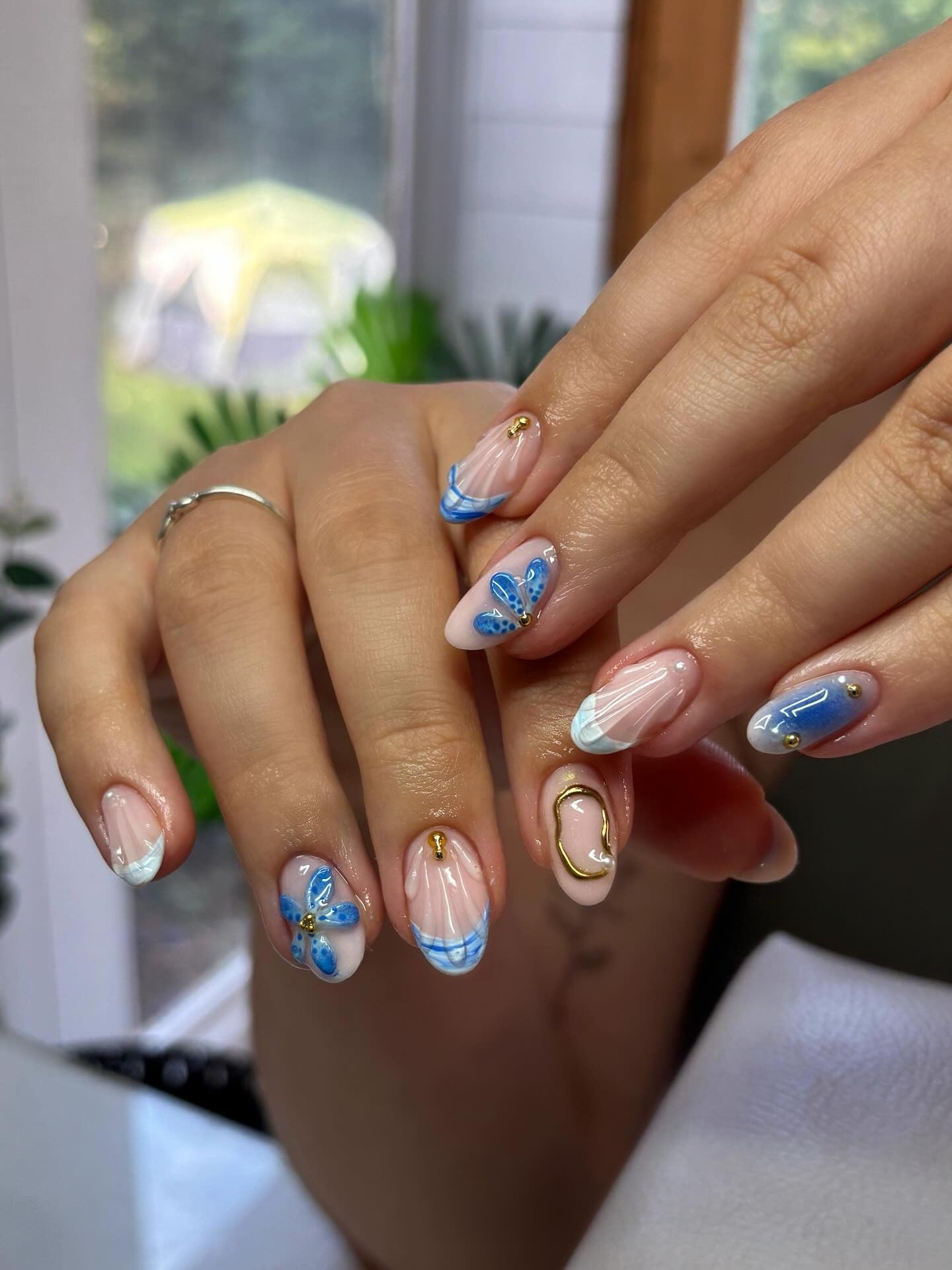 8. Blue Butterfly & Floral Nails with Gold Touches (Cool Nail Ideas)