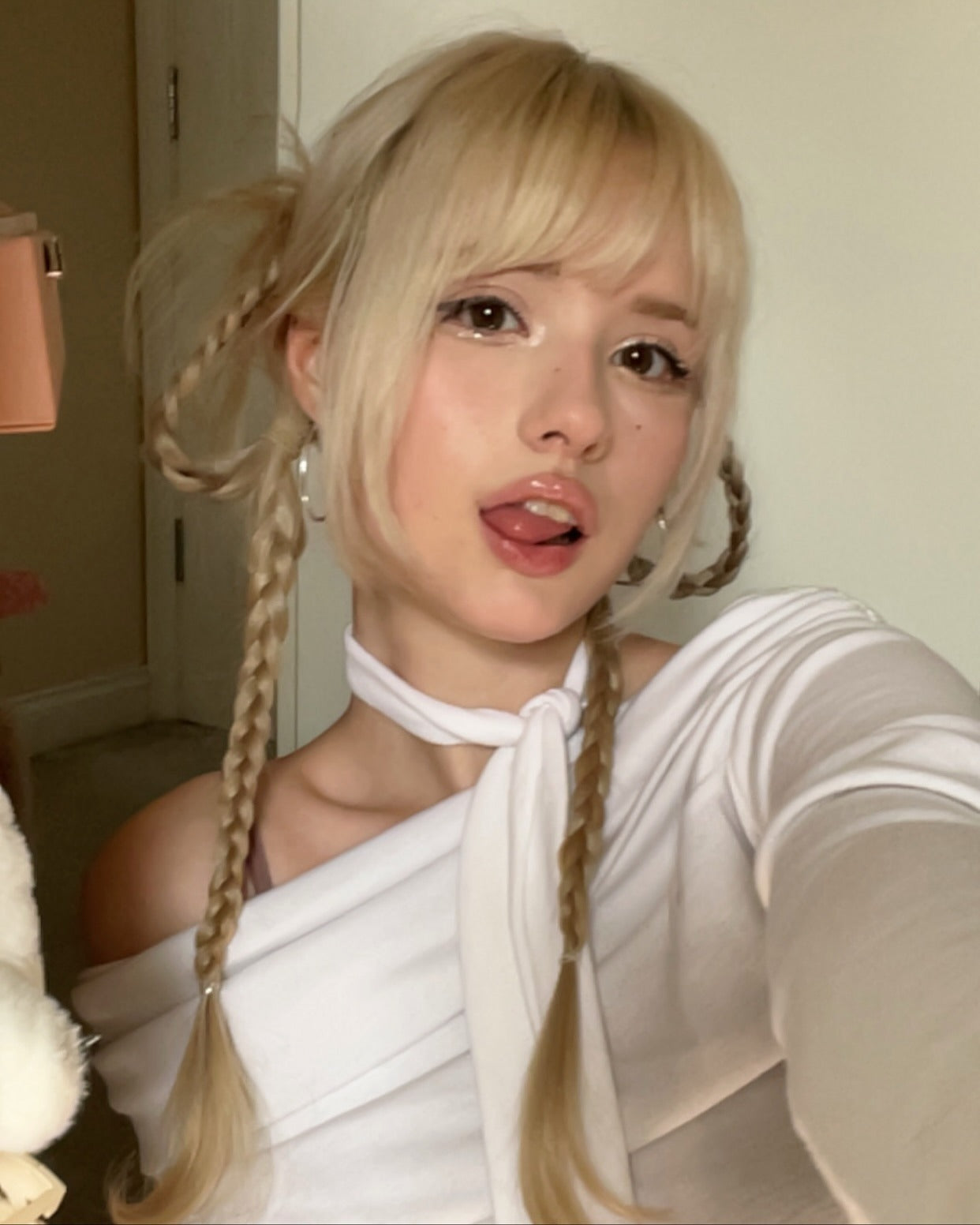 13. Playful Braided Pigtails with Face-Framing Bangs – Platinum Blonde (Cute Hairstyles)