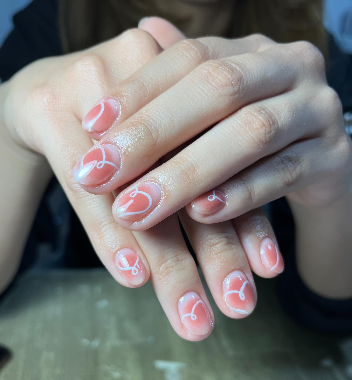 3. Coral Swirls with Glossy Finish (Cute Nail Ideas)