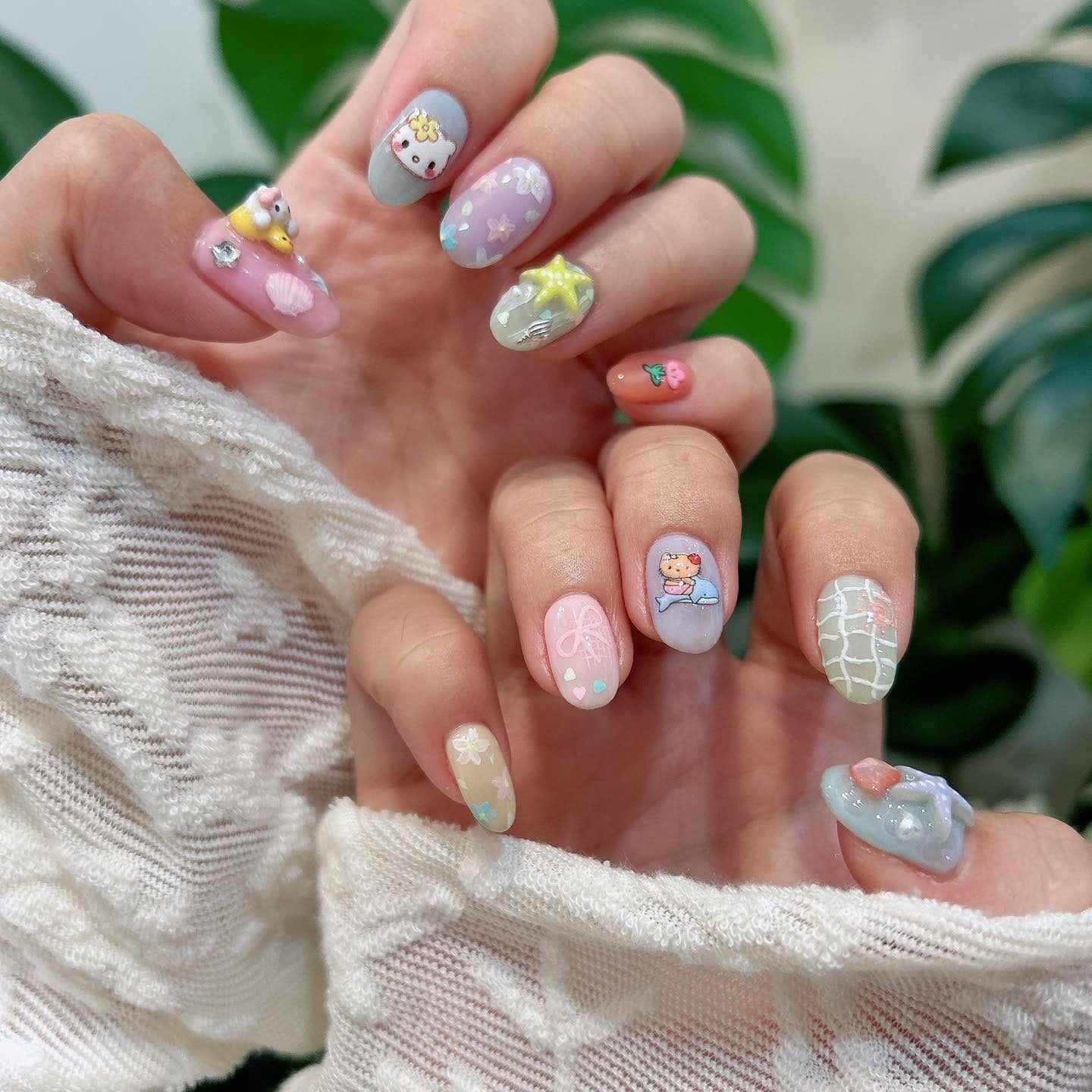 11. Pastel Fantasy Characters with 3D Accents (Cute Nail Ideas)