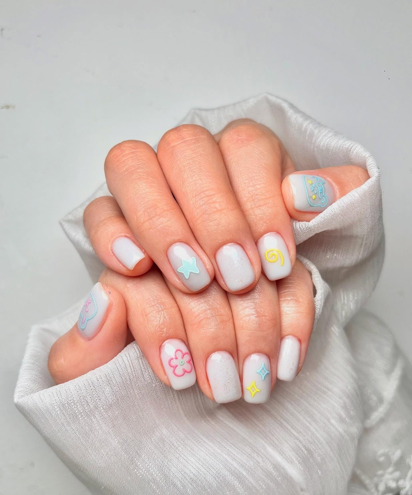 12. Minimal Pop Art on Pearl White (Cute Nail Ideas)