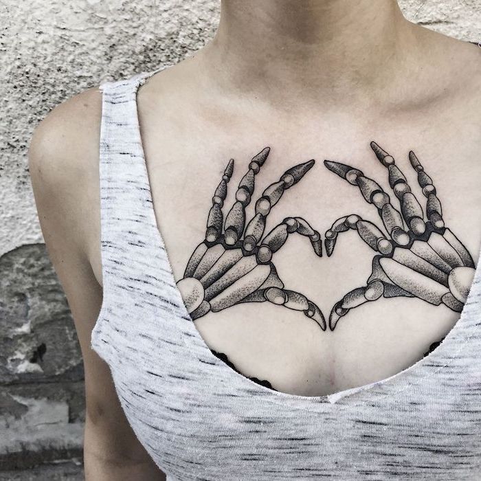 Skeleton hands heart shaped girl chest tattoos grey top grey ...