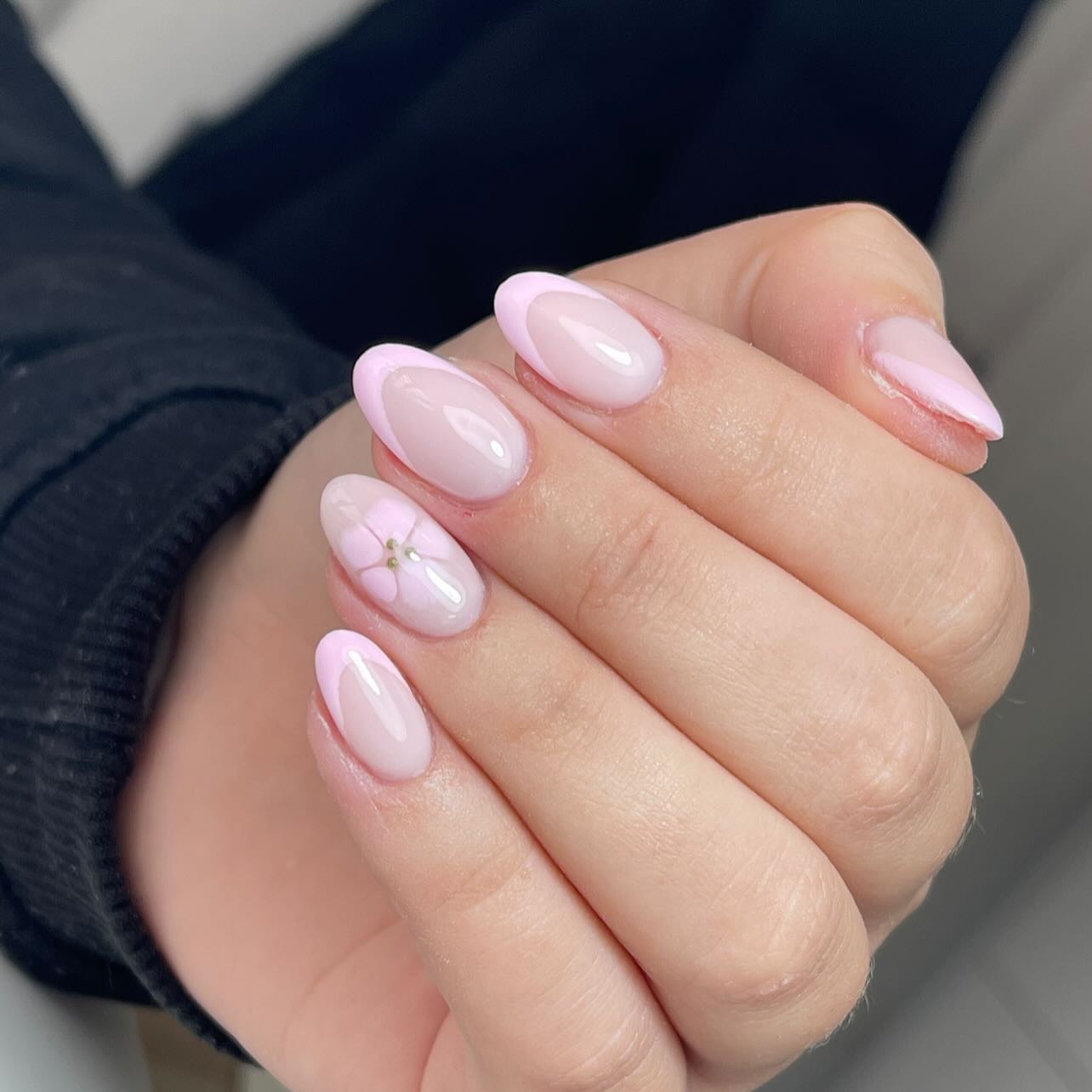 9. Minimal Pink French with Single Floral Accent (Light Pink Nail Ideas)